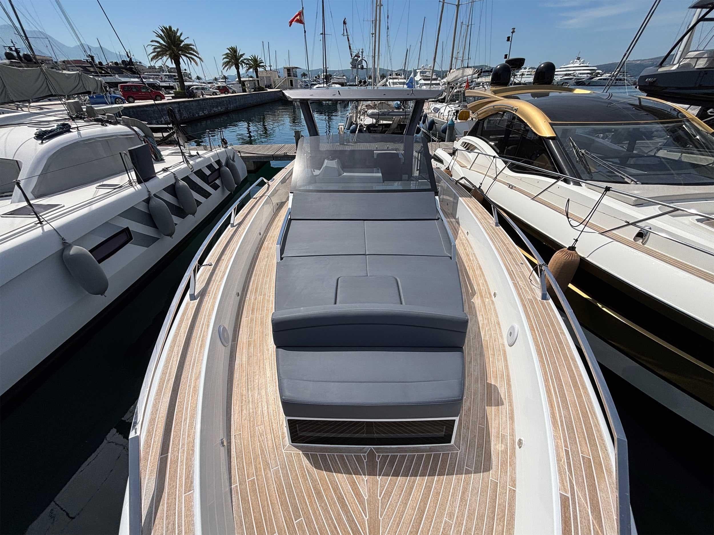 2024 Fiart 43 Seawalker yacht docked at marina, featuring sleek design and spacious deck.