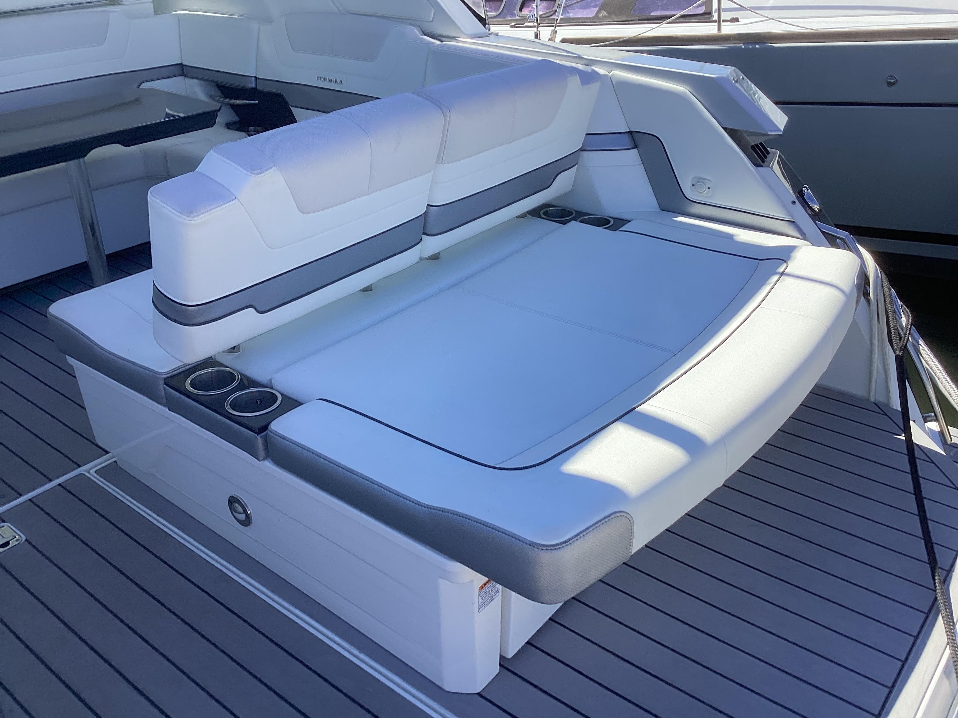 2020 Formula 380 Super Sport Crossover boat with spacious seating and sleek design.