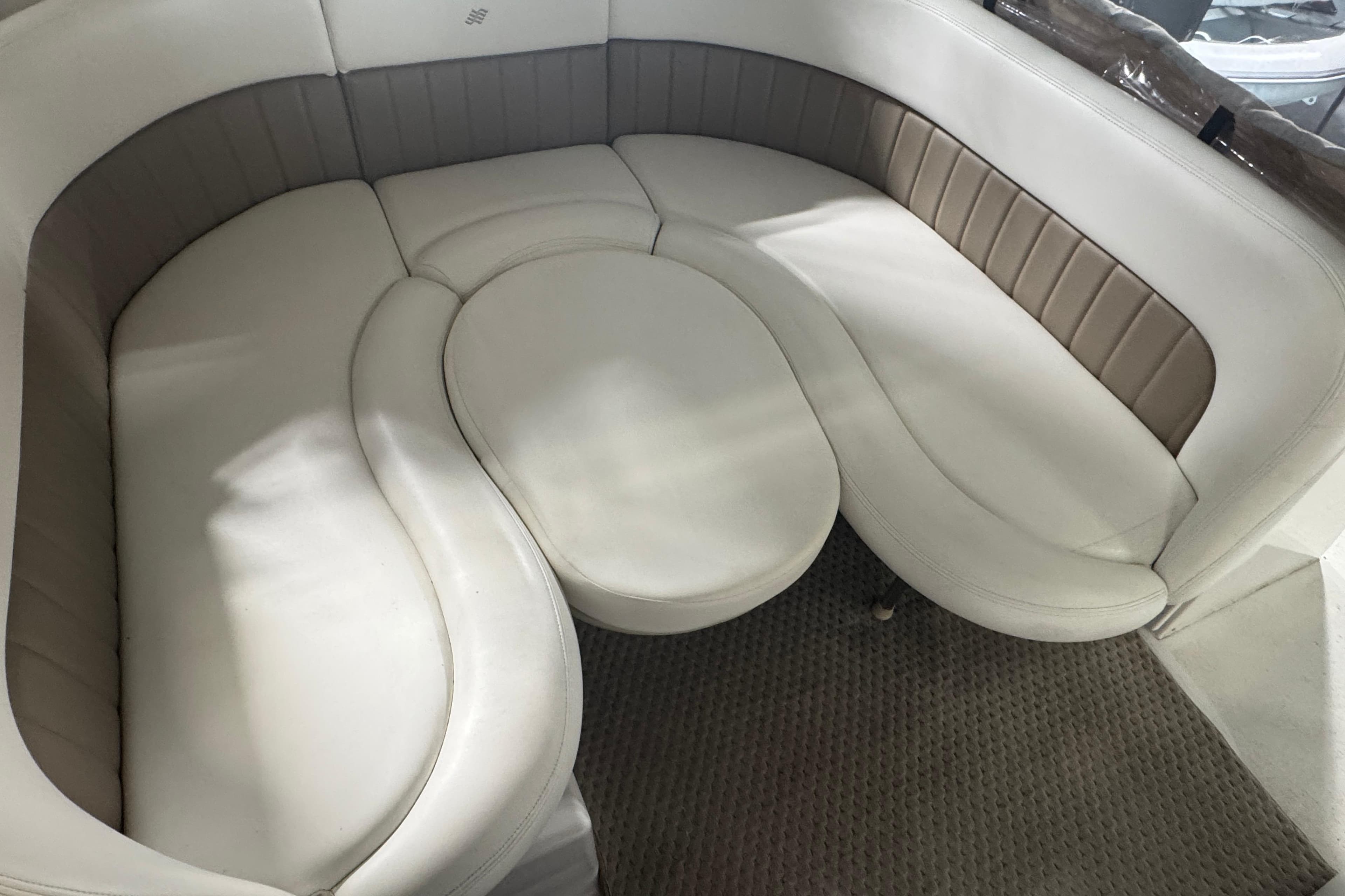 2004 Four Winns 268 Vista boat interior with curved white seating.
