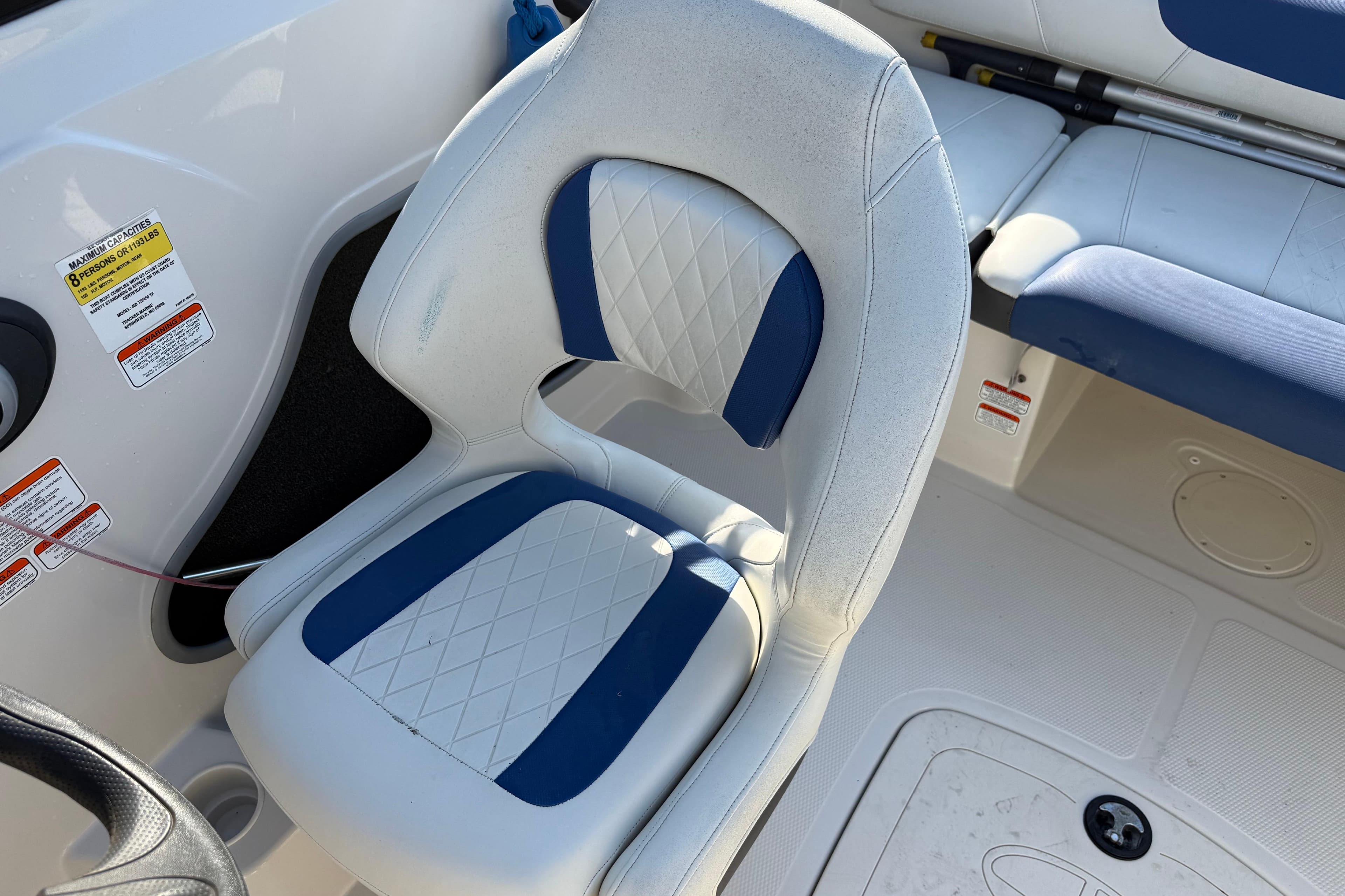 White and blue seating in a 2016 Tahoe 450 TS boat interior.