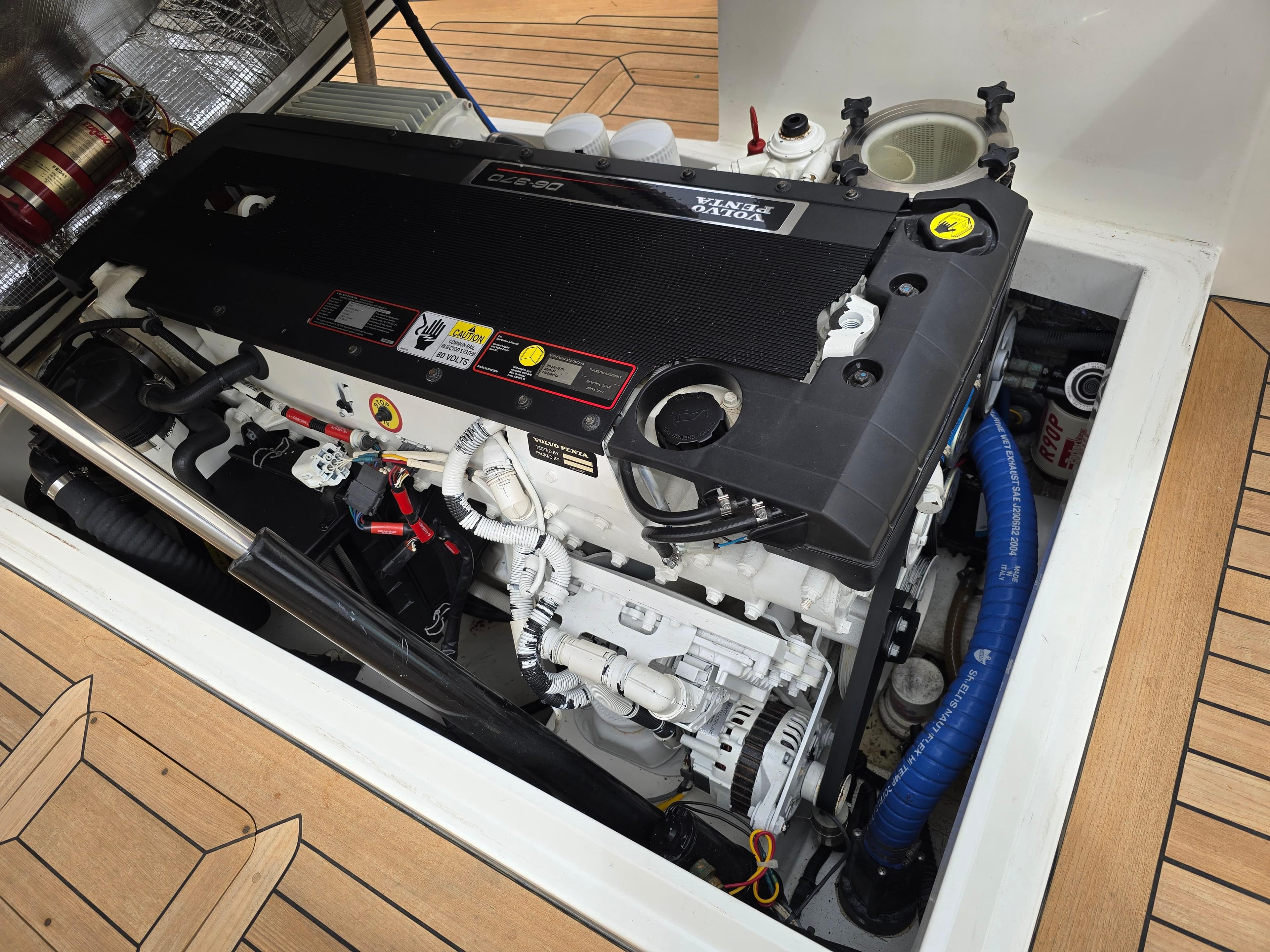 Engine compartment of a 2007 Hinckley Talaria 29 R boat, showcasing a clean, well-maintained engine.