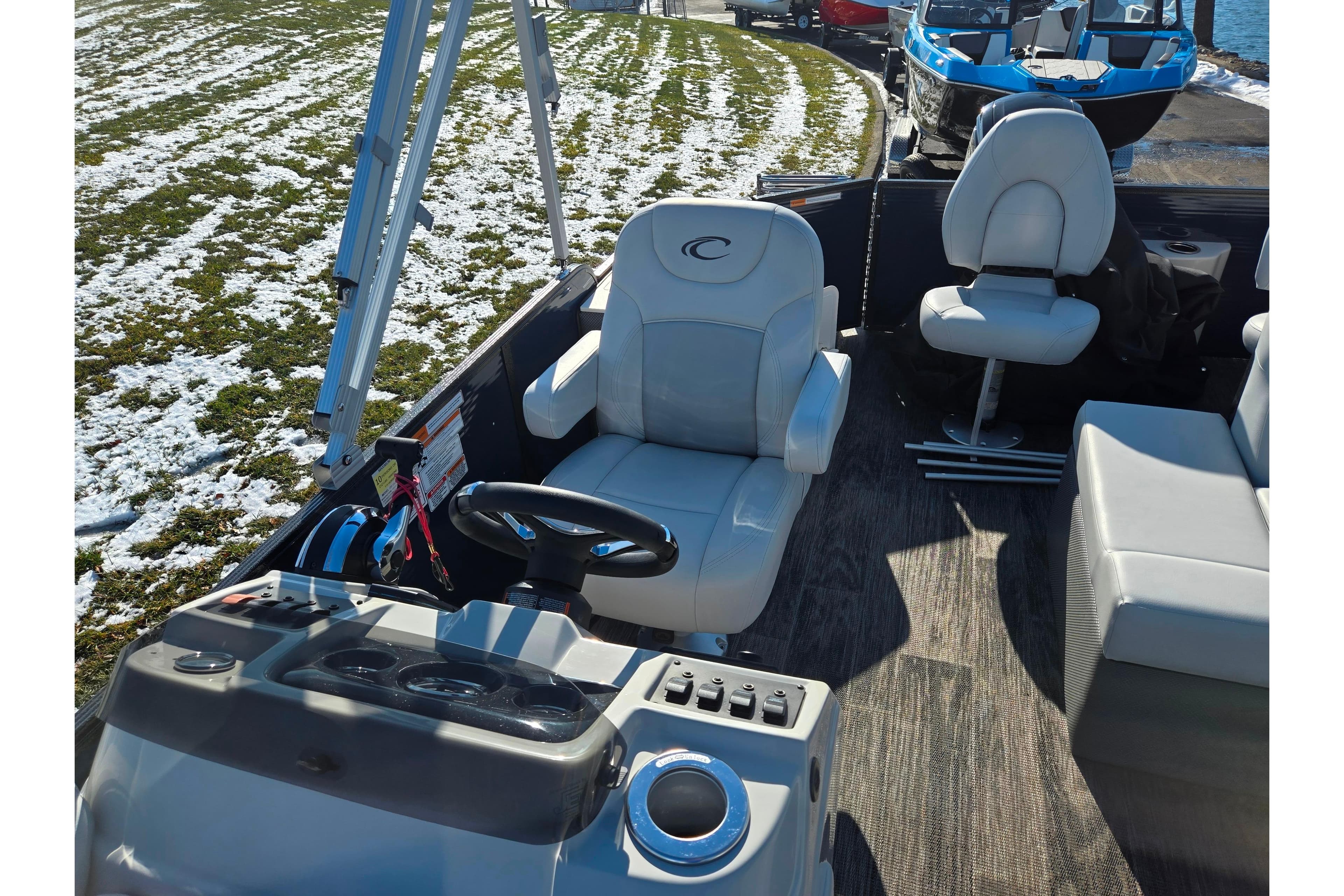 2022 Crest Classic Fish 200 boat interior with steering wheel and seating.