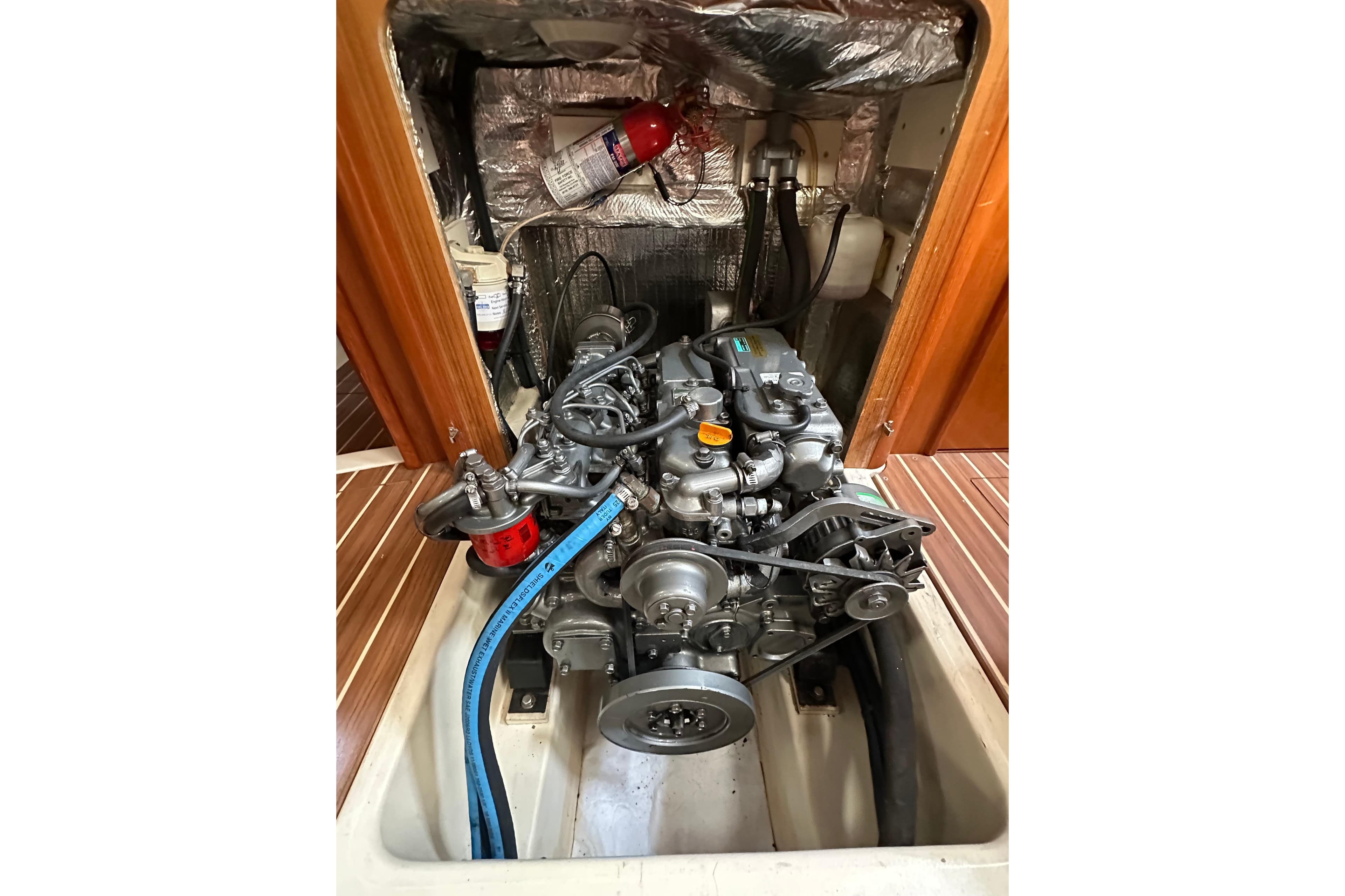 Engine compartment of 2003 Hunter 426 Deck Salon sailboat, showcasing mechanical components.