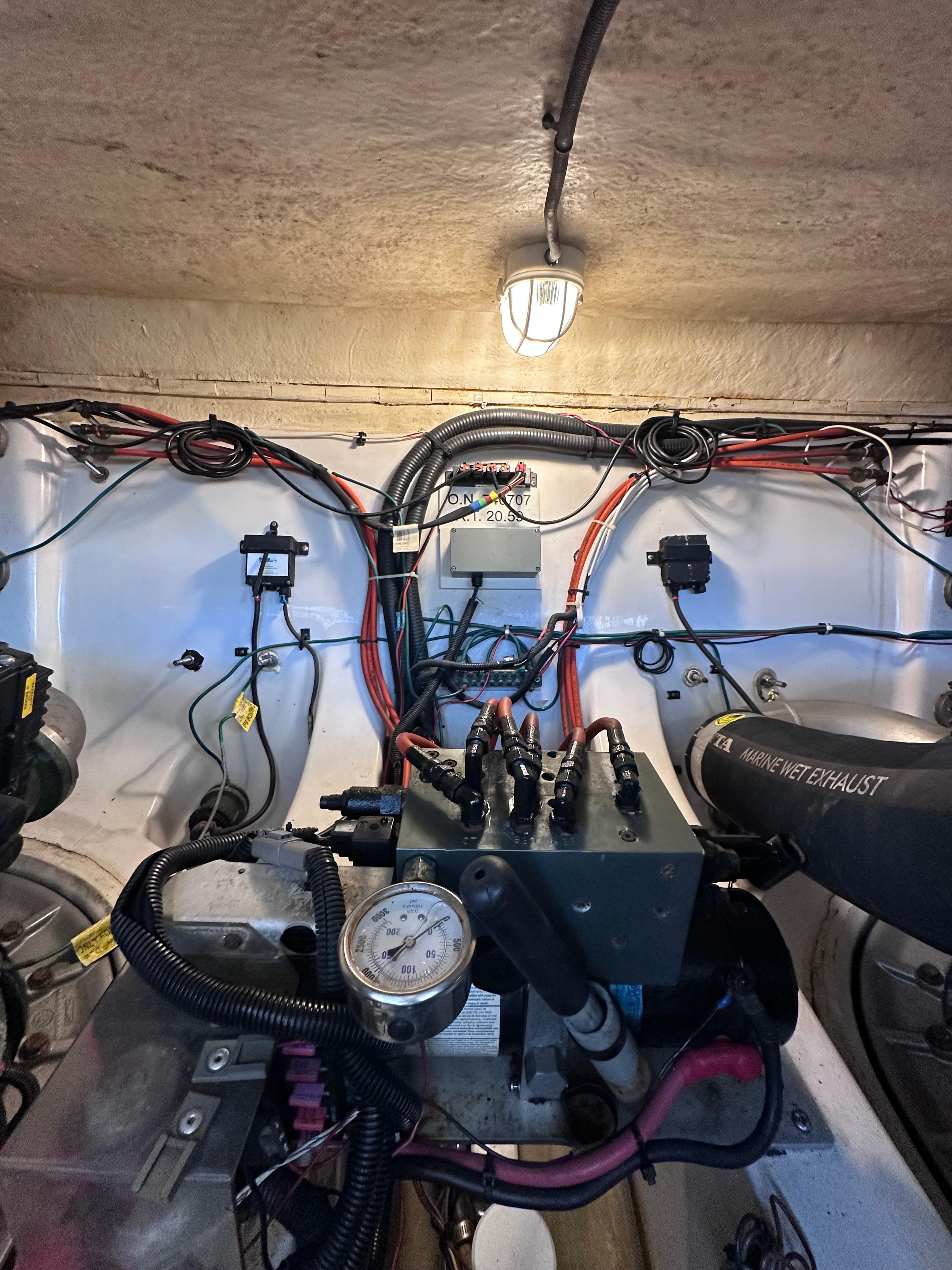 Engine room of 2008 Four Winns V458 boat with wiring and mechanical components.