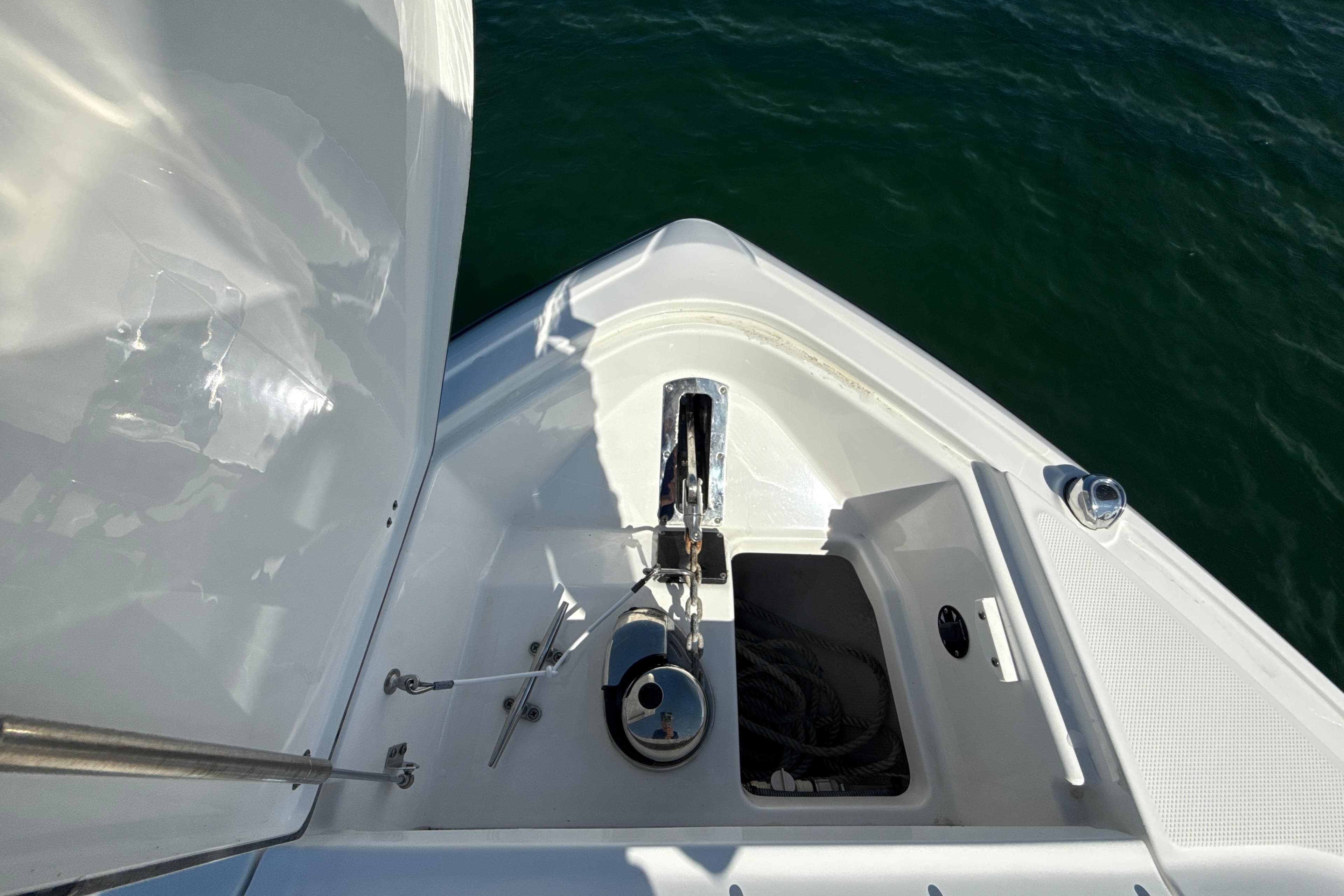 Bow view of 2019 Monterey 385 Super Express yacht with anchor and storage compartment.