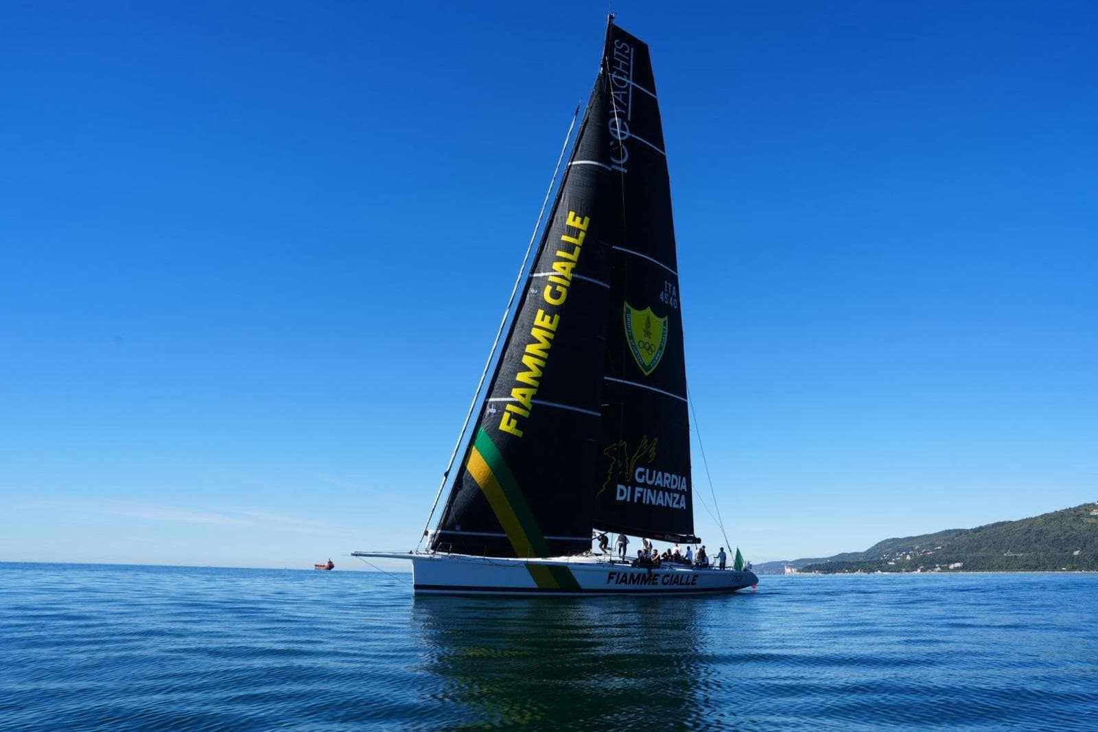 Sailing yacht McConaghy Reichel Pug 79, 1995, on calm sea under clear blue sky.