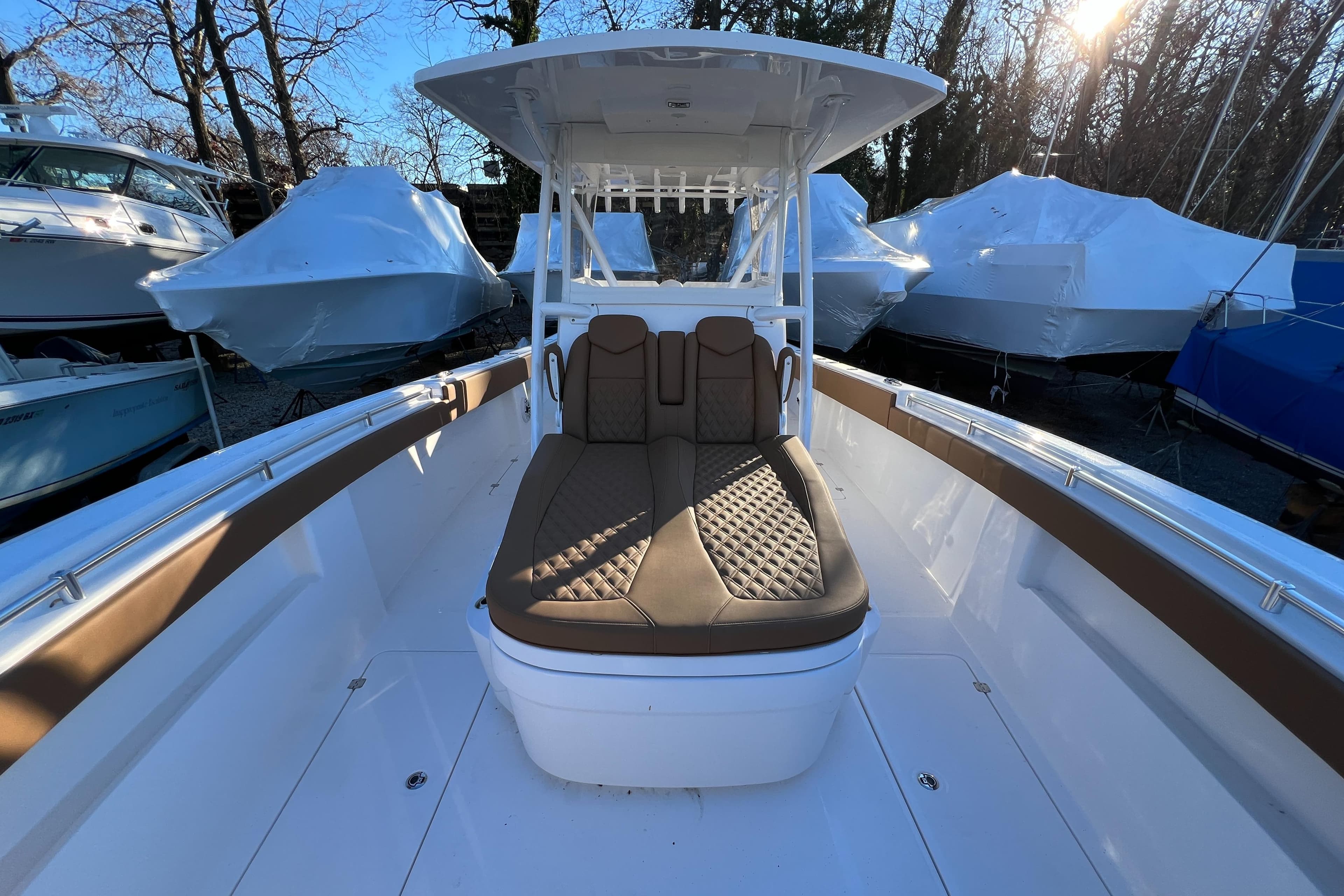 2025 Invincible 33 Catamaran with cushioned seating and center console.