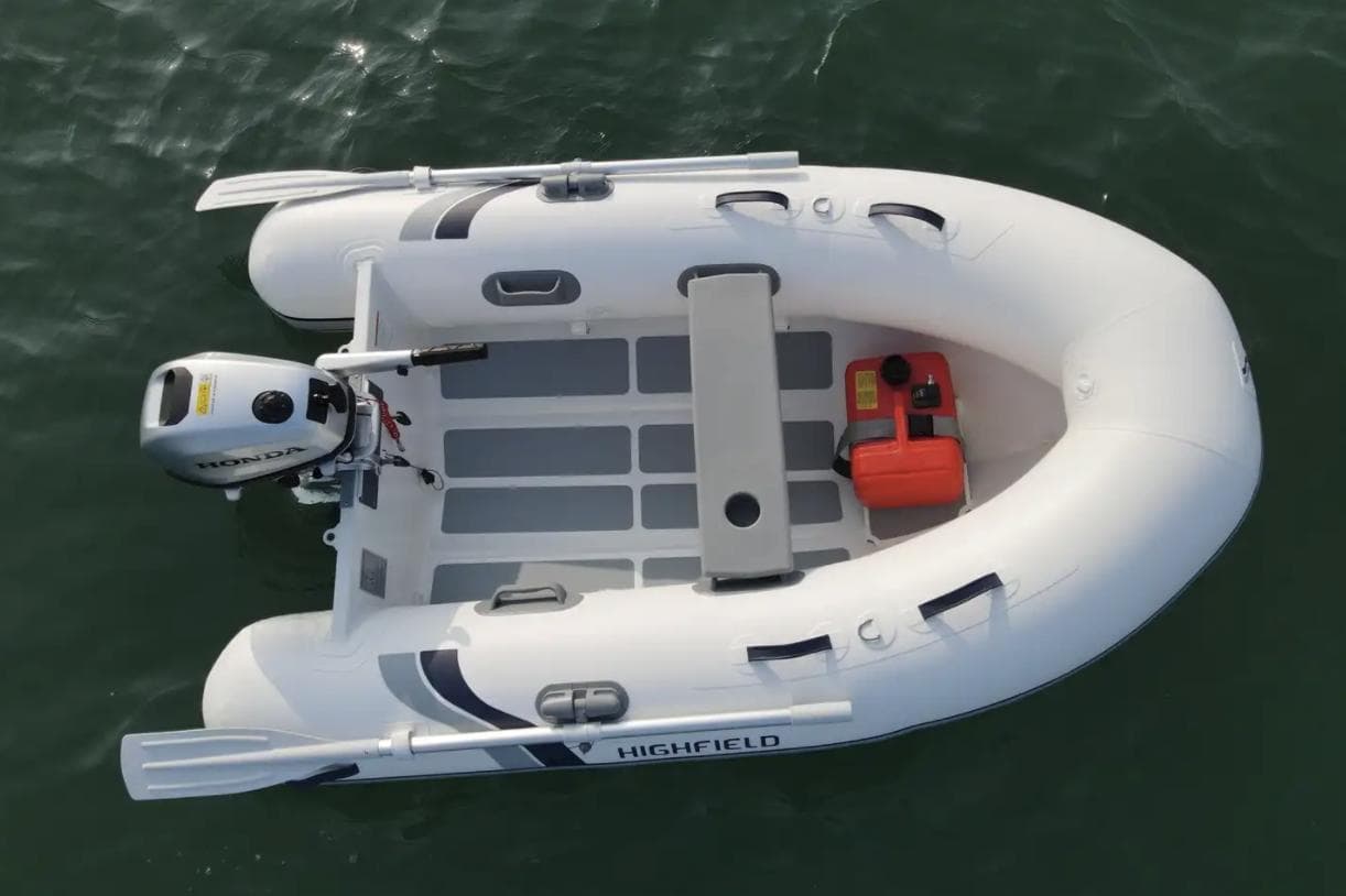 2024 Highfield Ultralite 240LT inflatable boat on water, featuring an outboard motor.