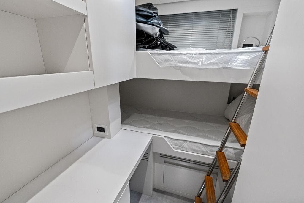 Compact bunk bed cabin interior on 2025 Pershing GTX 80 yacht.