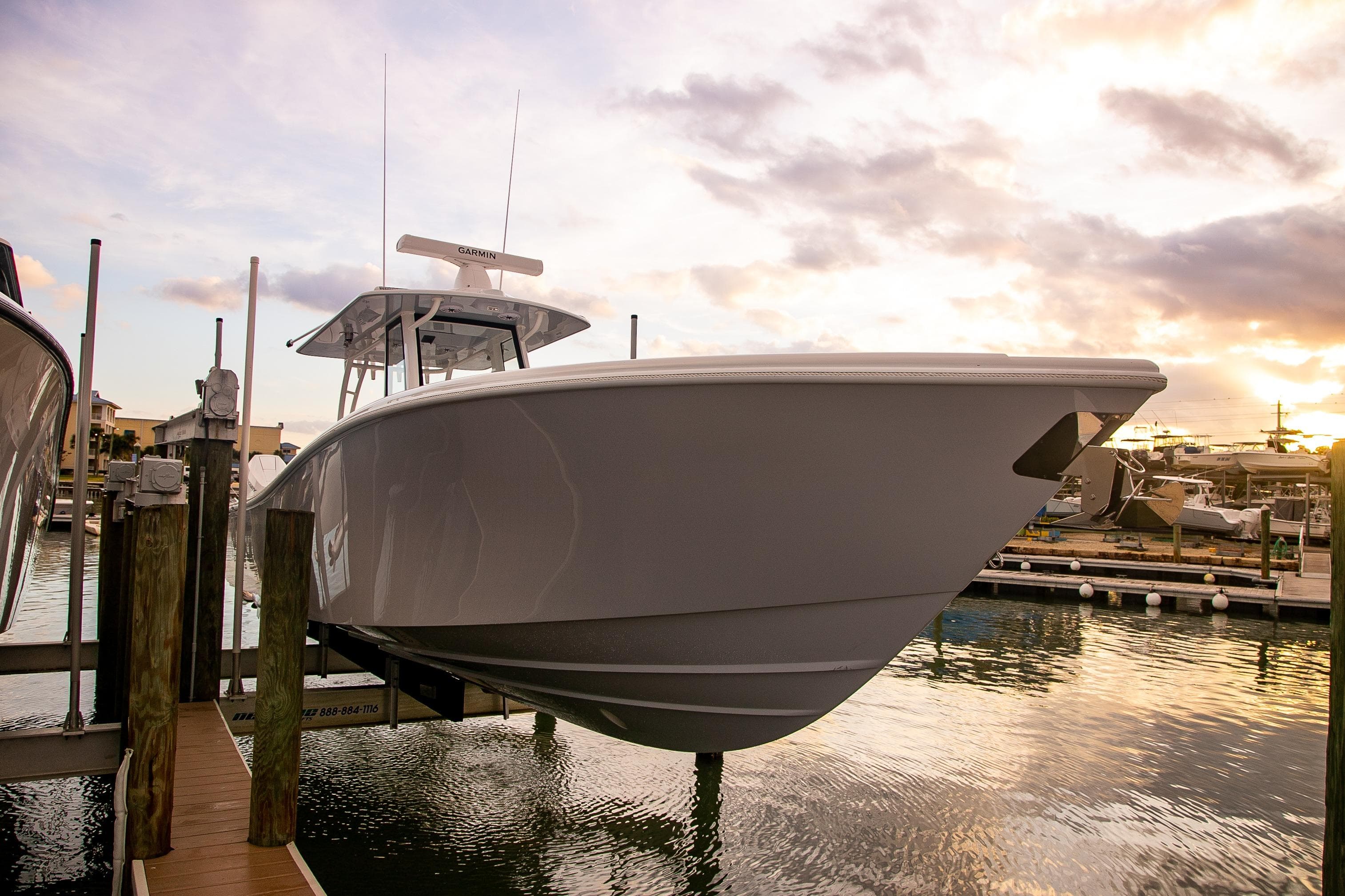 2026 Yellowfin 36 Offshore boat docked at sunset, showcasing sleek design and modern features.