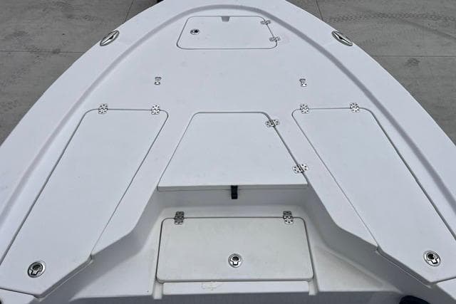 2021 Sportsman Tournament 234 SBX Bay Boat deck with storage compartments.