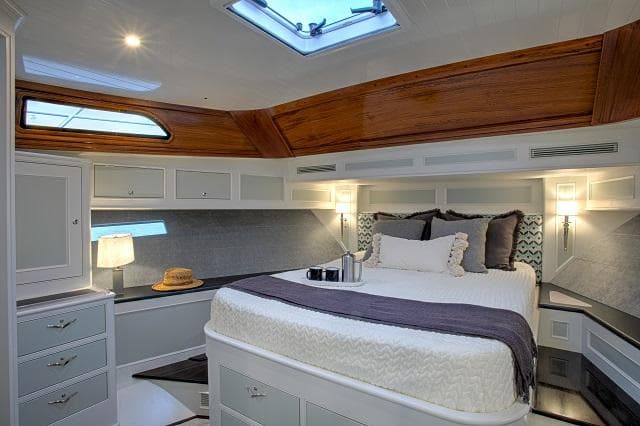 Luxurious cabin interior of 2027 C.W. Hood 57 LM yacht with elegant wood accents.