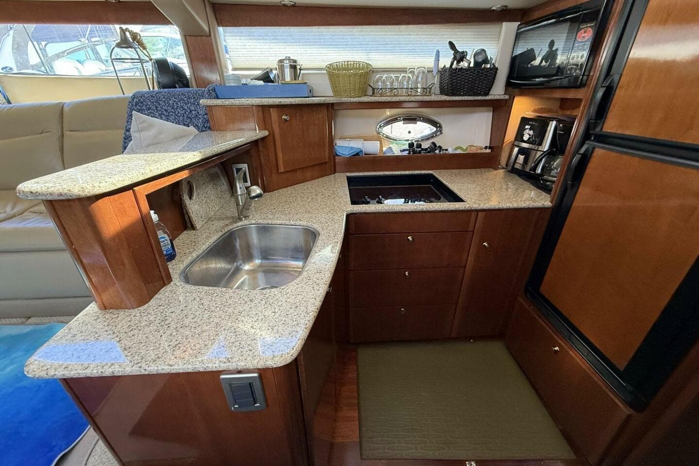 Luxurious kitchen interior of 2008 Meridian 459 Motoryacht with granite countertops and modern appliances.
