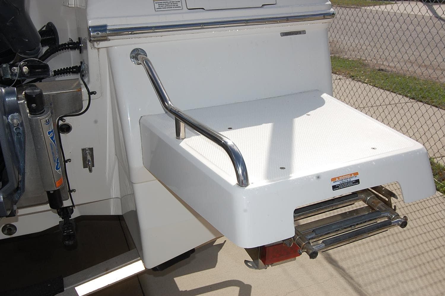 2019 Robalo 226 Cayman swim platform with stainless steel handrail and ladder.