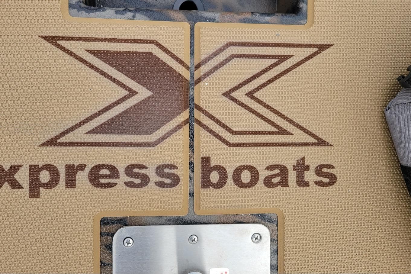 2026 Xpress H20 Bass boat deck with logo and textured surface.