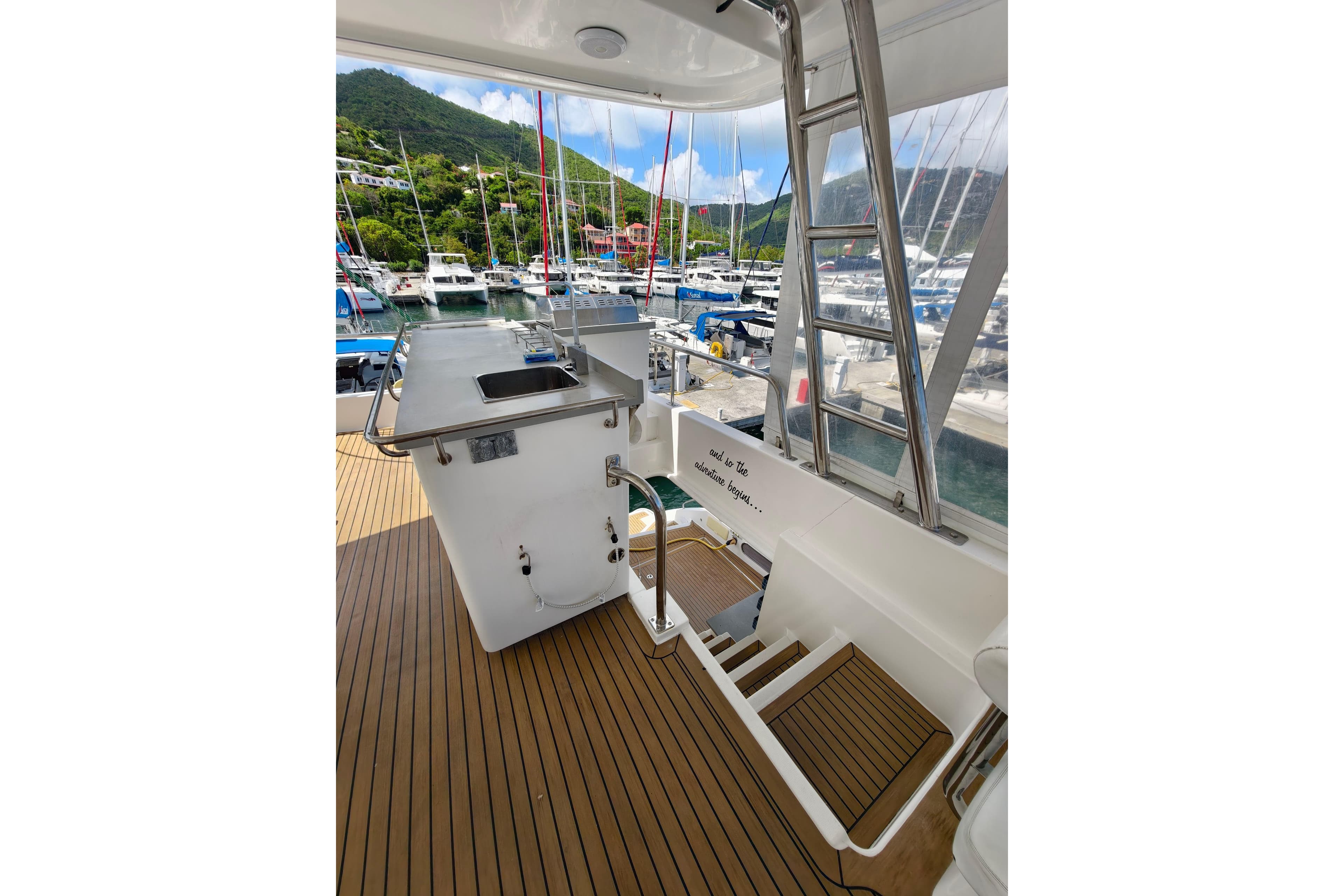 Leopard 58 yacht deck with sink and ladder, docked at marina, 2020 model.