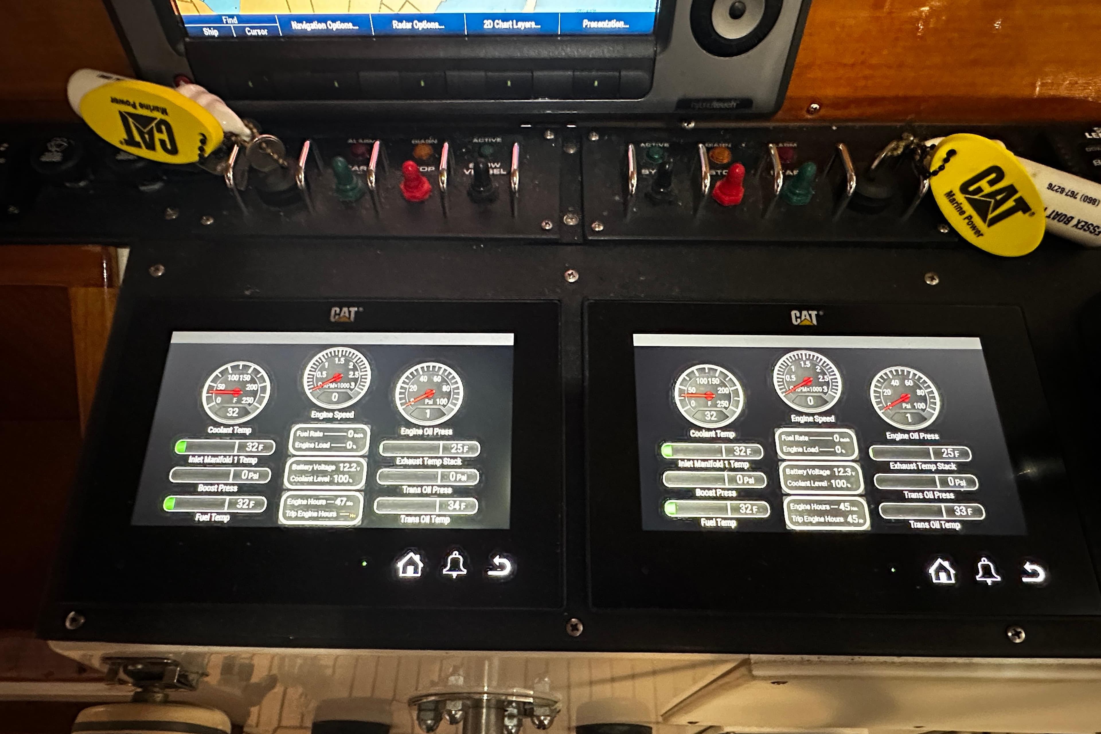 Control panel of a 1995 Grand Banks 38 Eastbay EX with CAT engine displays.