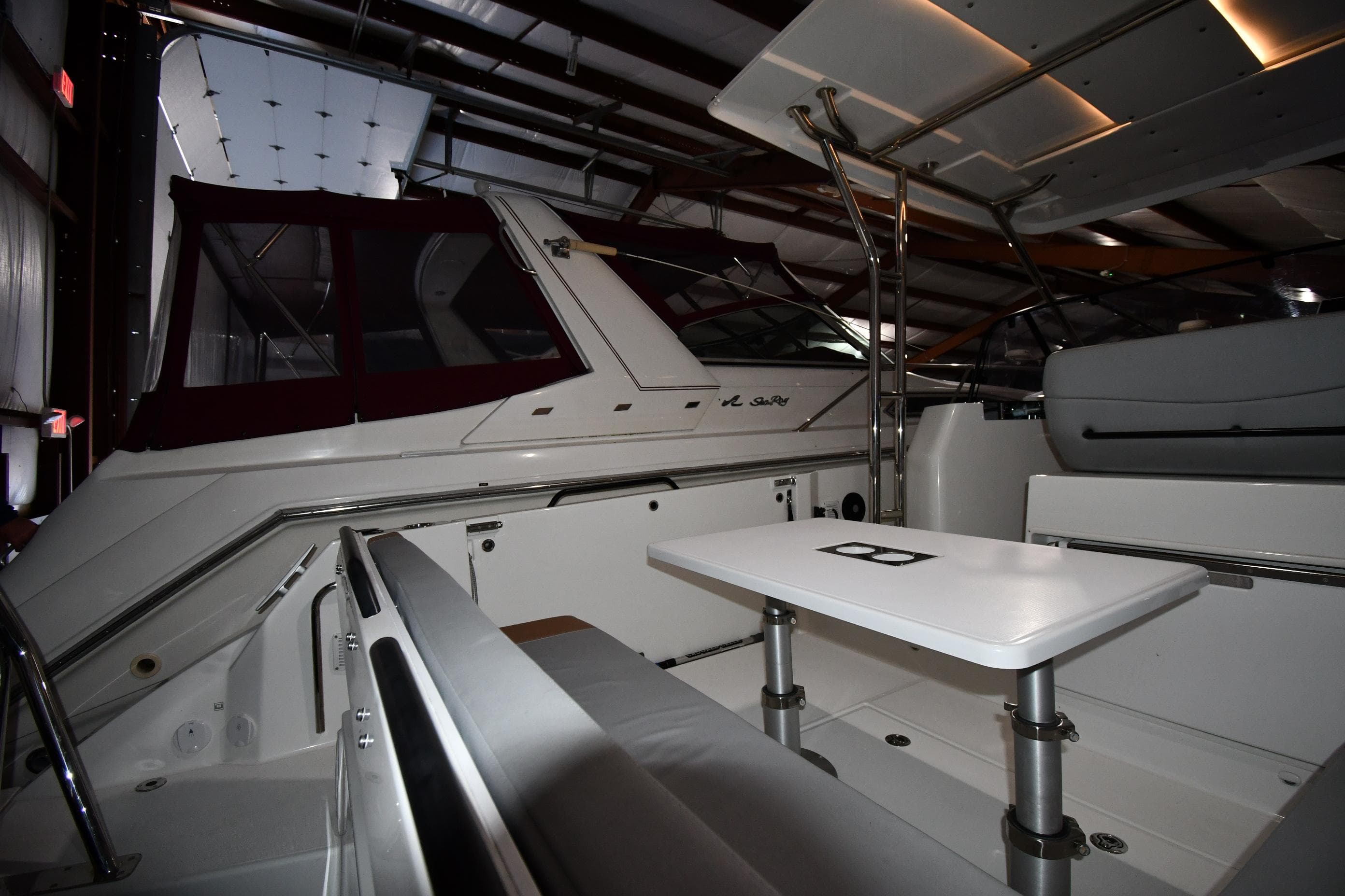 2023 Beneteau Flyer 9 SUNdeck interior, featuring sleek seating and a modern table setup.
