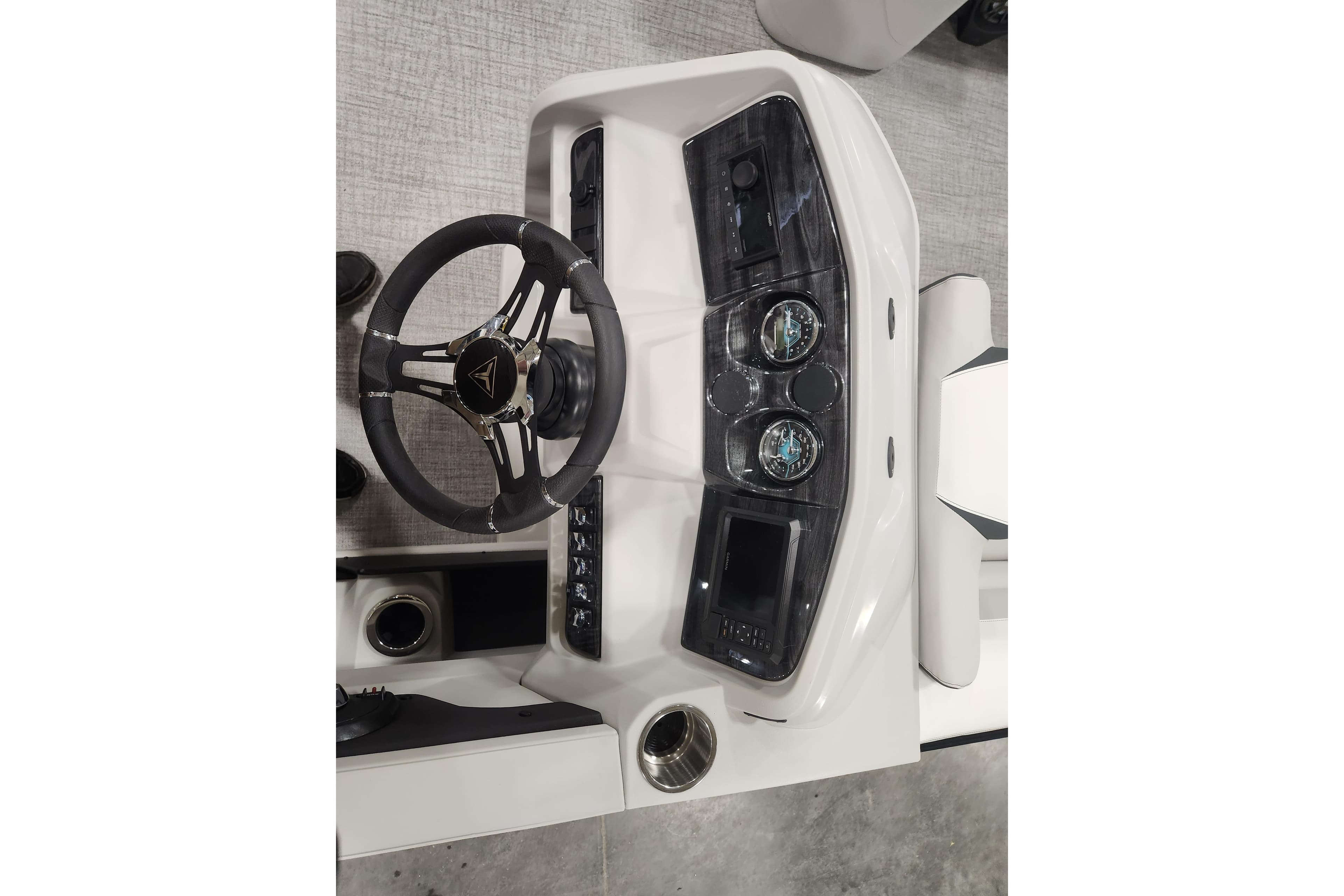 Steering console of 2026 Tahoe Pontoon 23 LTZ Rear Bench with modern controls and gauges.