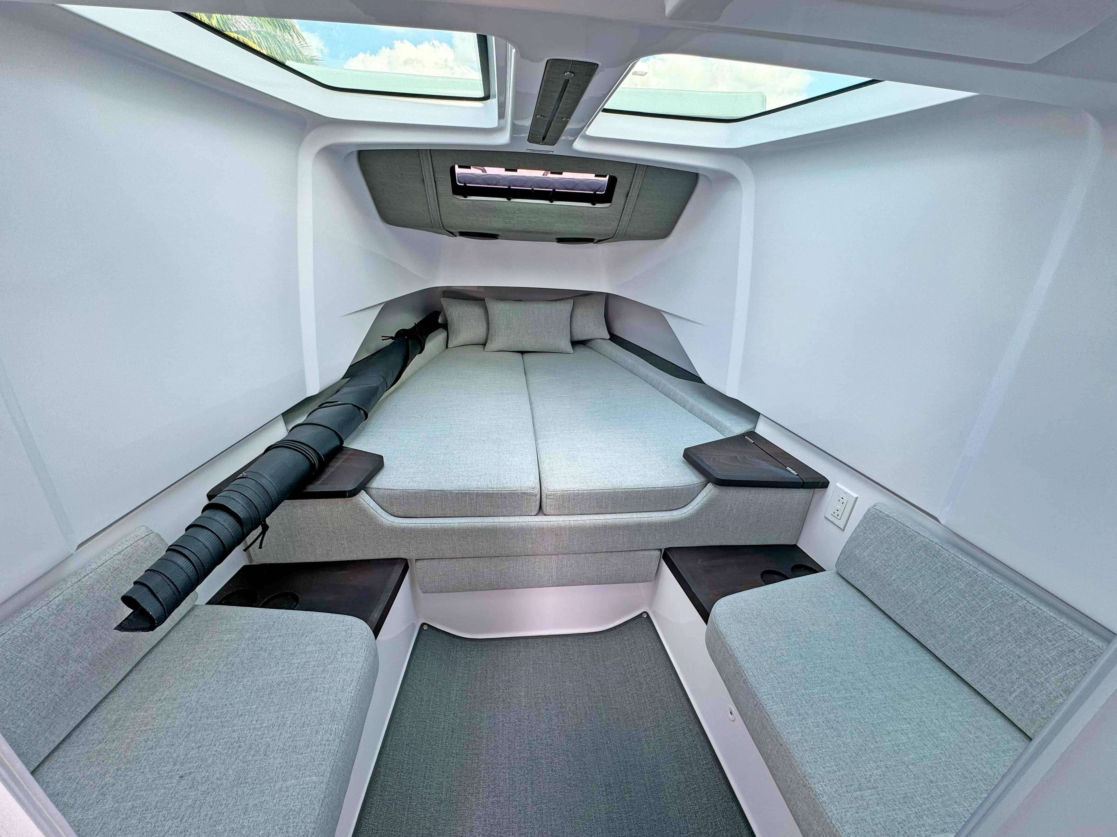 2024 Axopar 37 Sun Top cabin interior with modern seating and skylight.