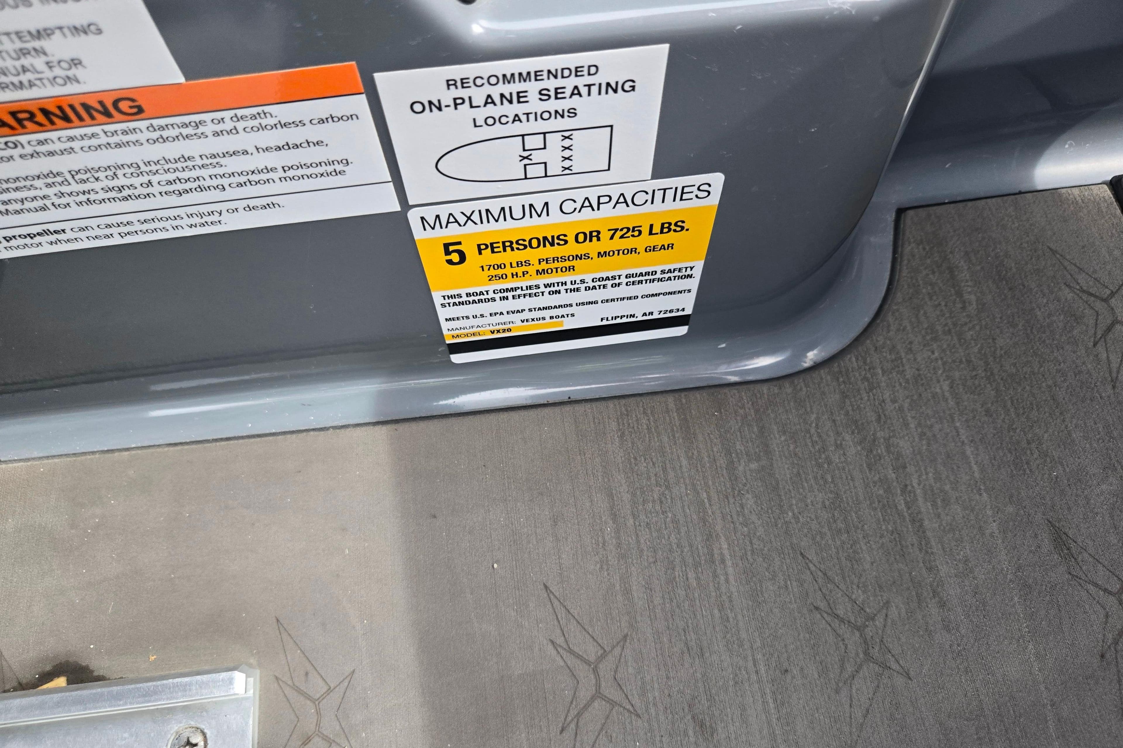 2022 Vexus VX20 boat capacity label, maximum 5 persons or 725 lbs, safety warnings visible.