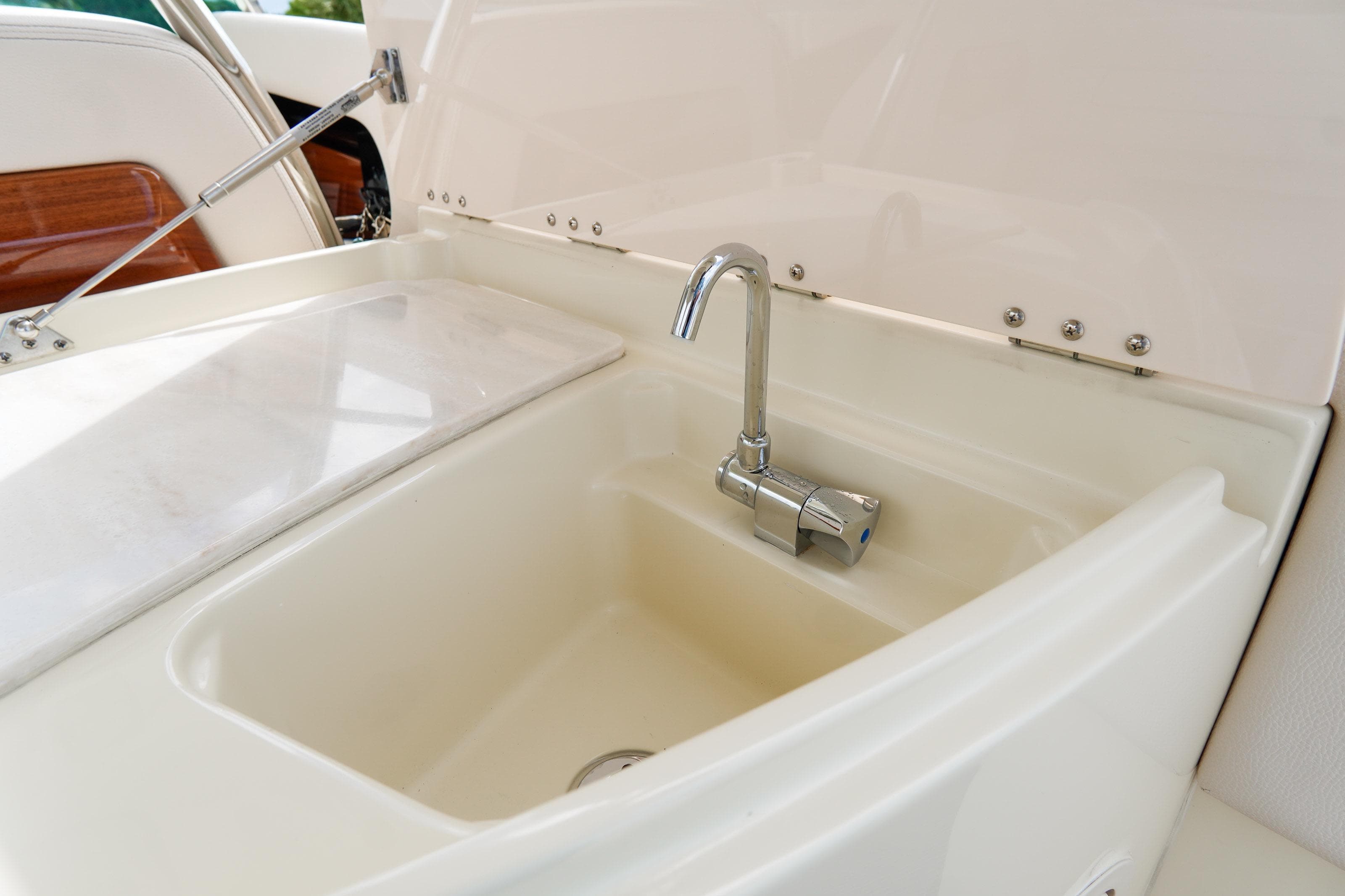 2024 Chris-Craft Launch 31 GT boat sink with chrome faucet.