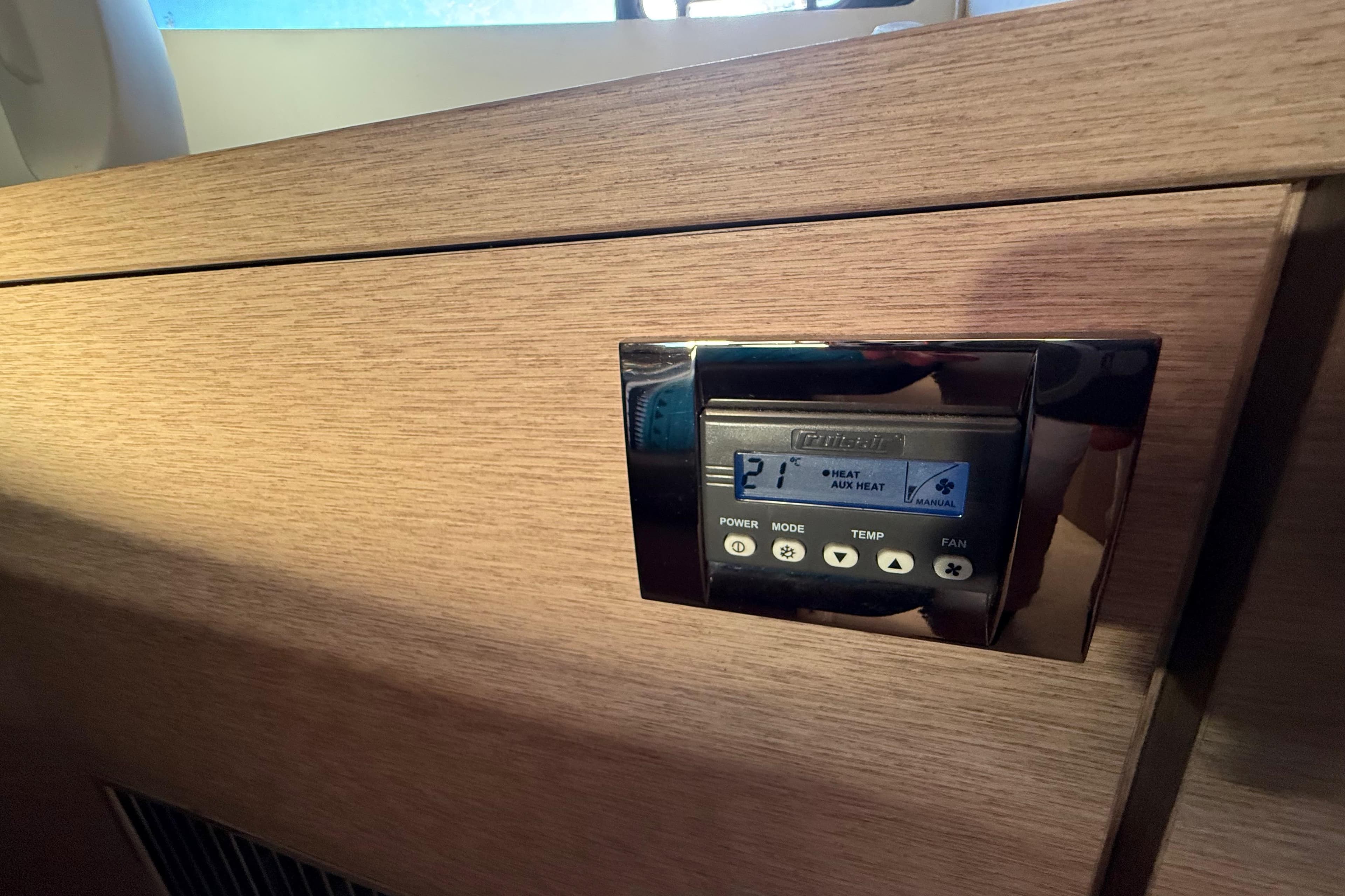 Control panel on 2018 Prestige 500 yacht, displaying temperature and fan settings.