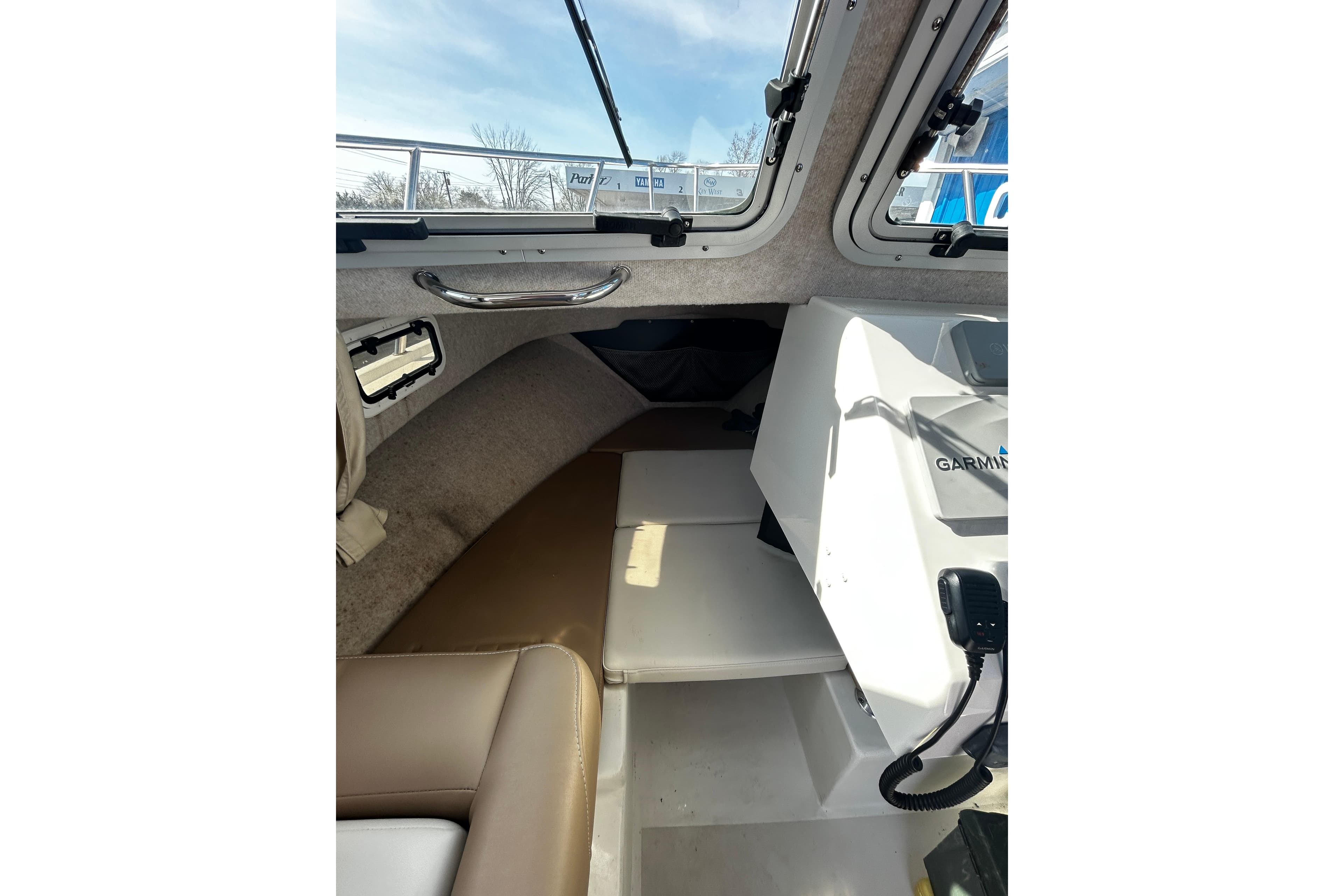 Interior view of 2019 Parker 2320 Sport Cabin boat with Garmin equipment.