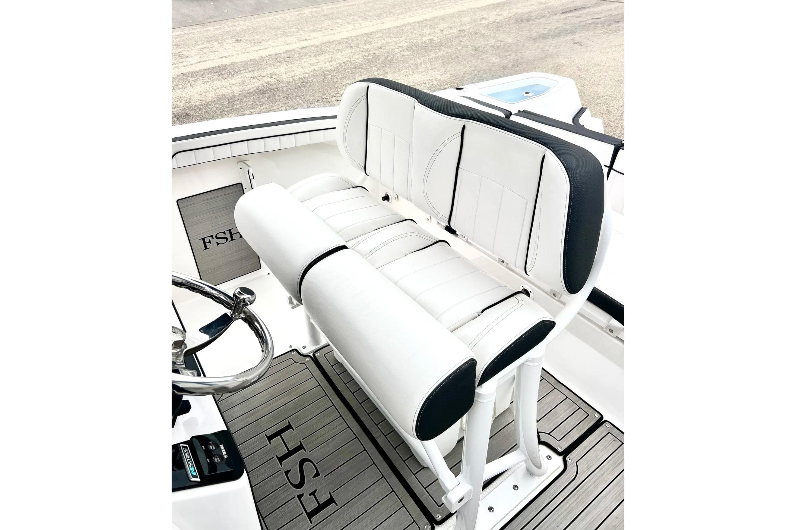 2022 Yamaha Boats 255 FSH Sport H interior seating with sleek white and black design.