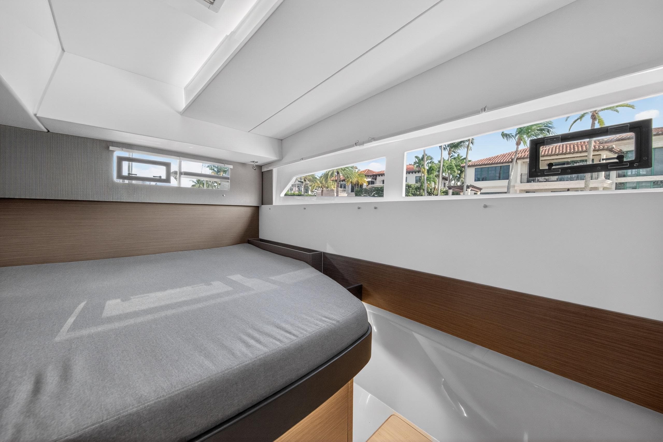 Modern interior cabin of 2022 Leopard 50 yacht with large windows and sleek design.