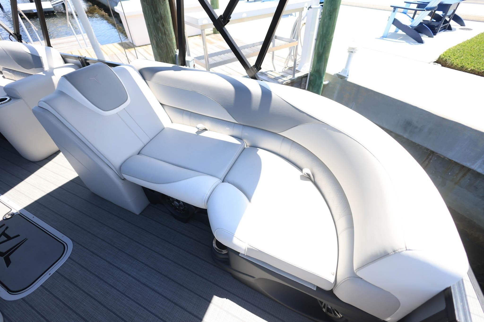 Luxurious seating on 2025 Tahoe Pontoon LTZ 23, featuring sleek white upholstery.