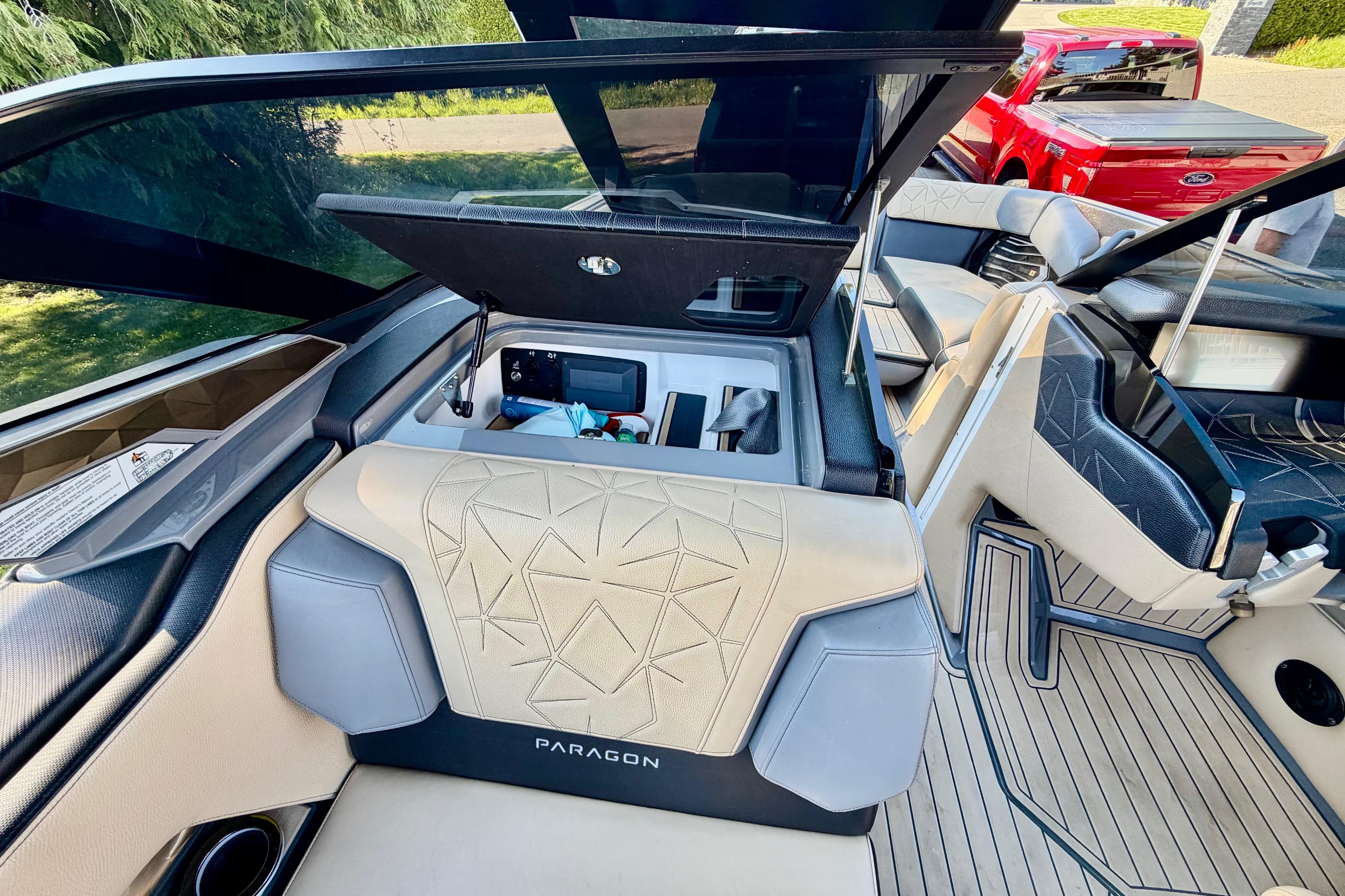 2020 Nautique Super Air Nautique G23 Paragon interior with open storage compartment.