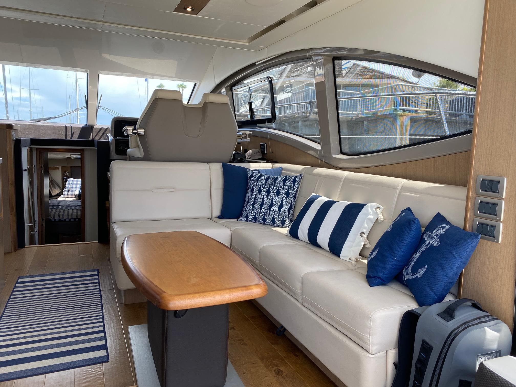 Luxurious interior of 2018 Sea Ray 400 Fly yacht with elegant seating and nautical decor.