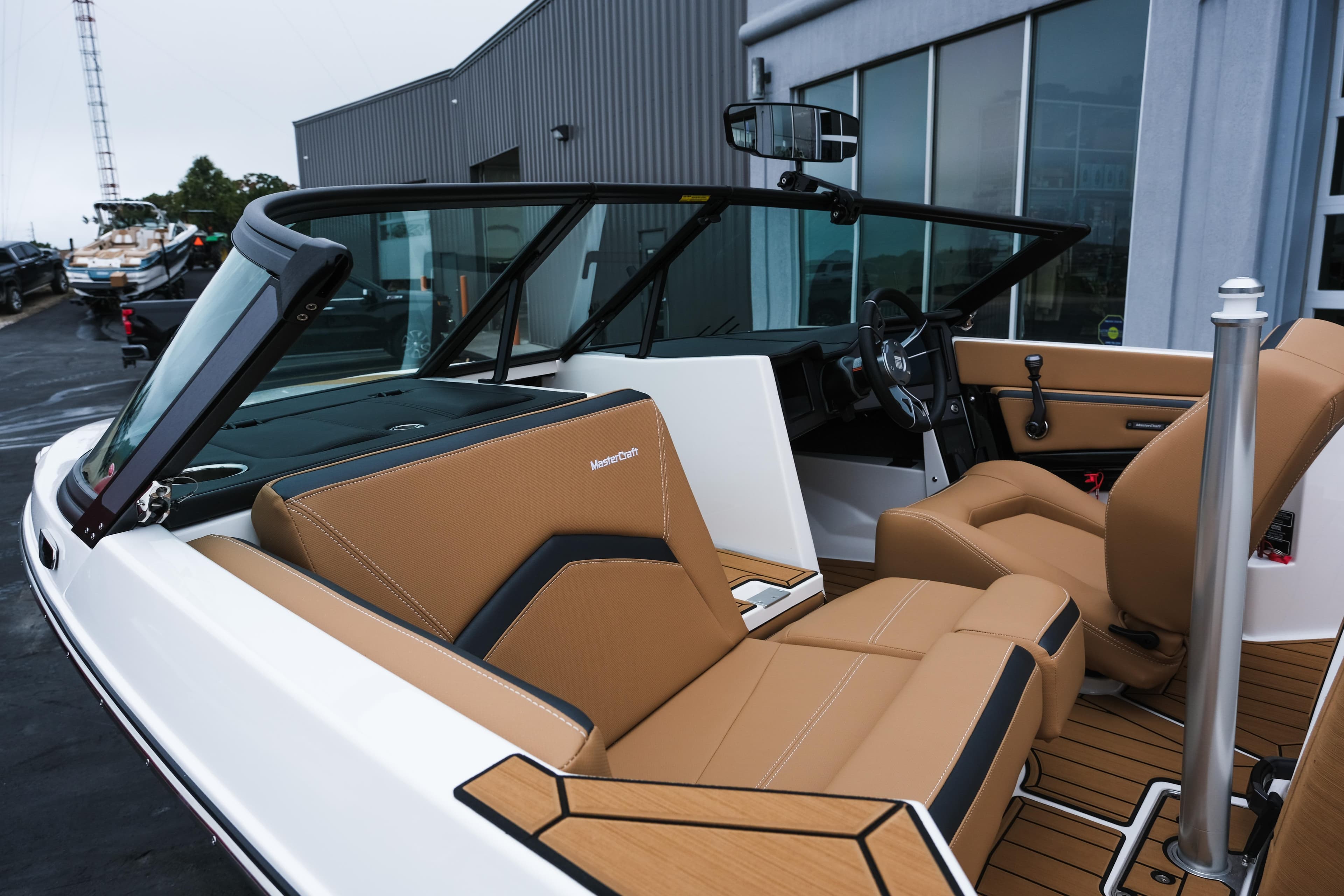 2026 MasterCraft ProStar 190 boat interior with tan leather seats and modern dashboard.