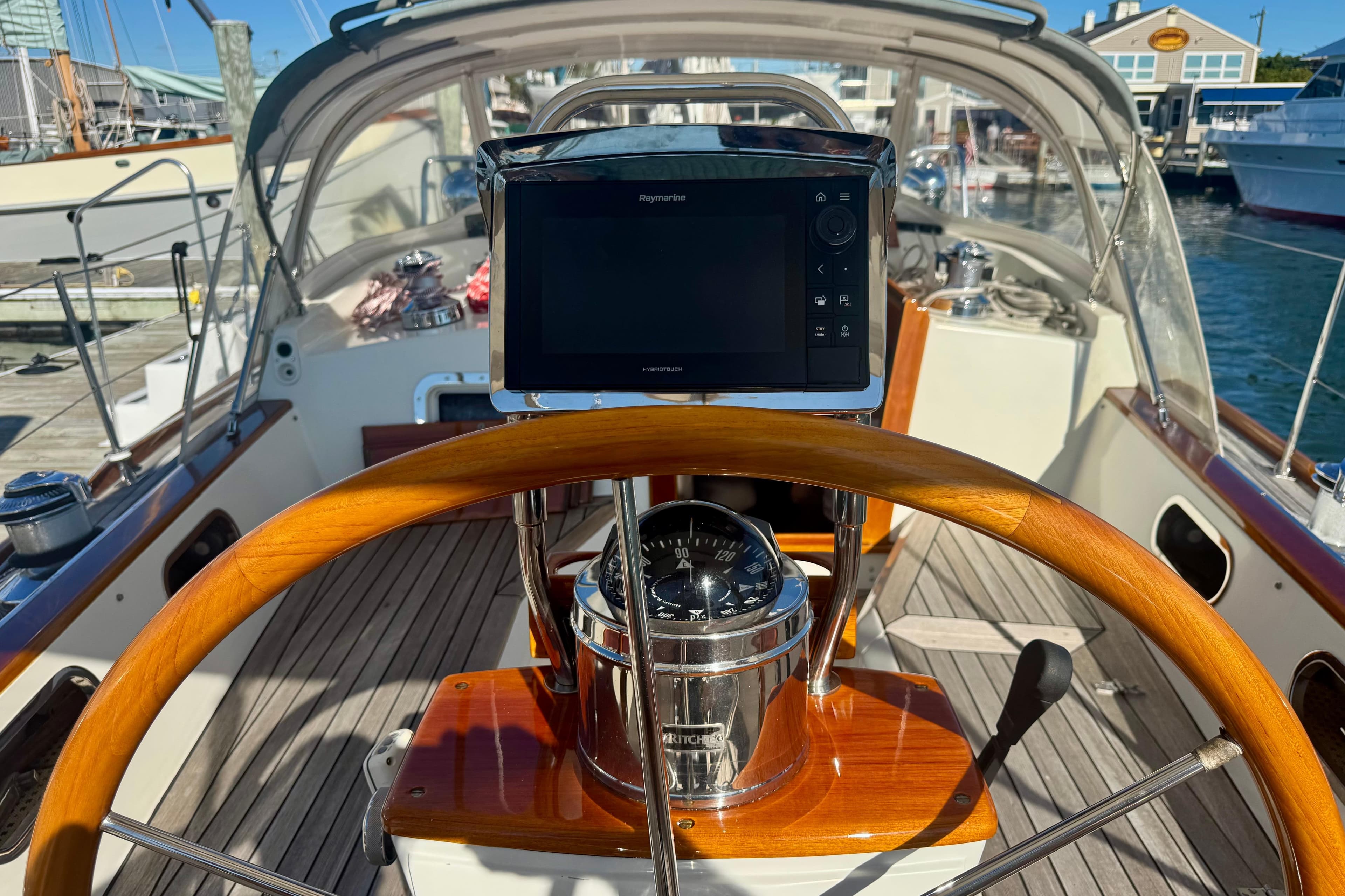 Hinckley Sou'wester 52 yacht cockpit with wooden wheel and navigation equipment, 1999 model.