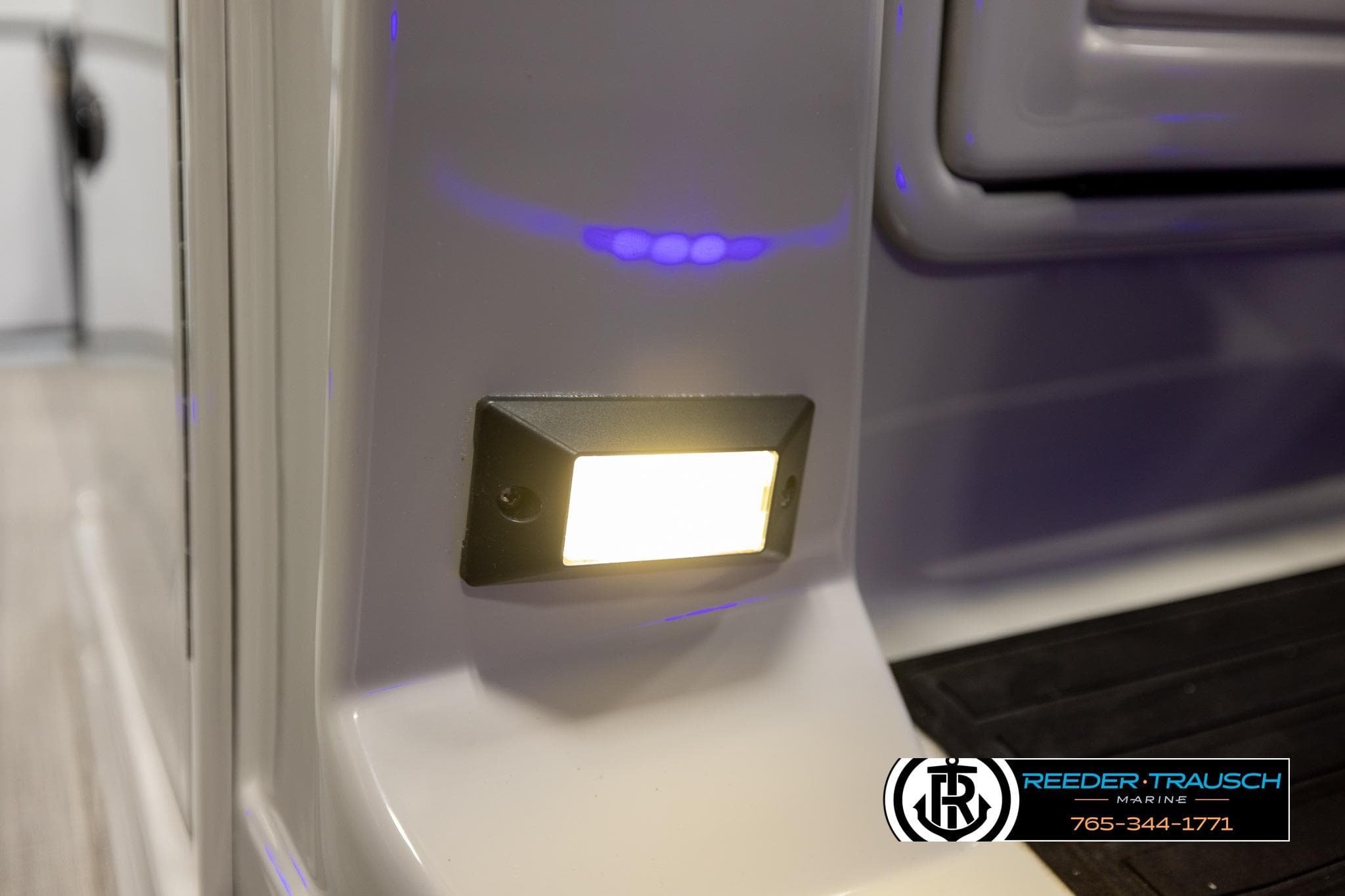 Close-up of 2023 SunChaser 23 Eclipse SSB boat light with Reeder-Trausch Marine logo.