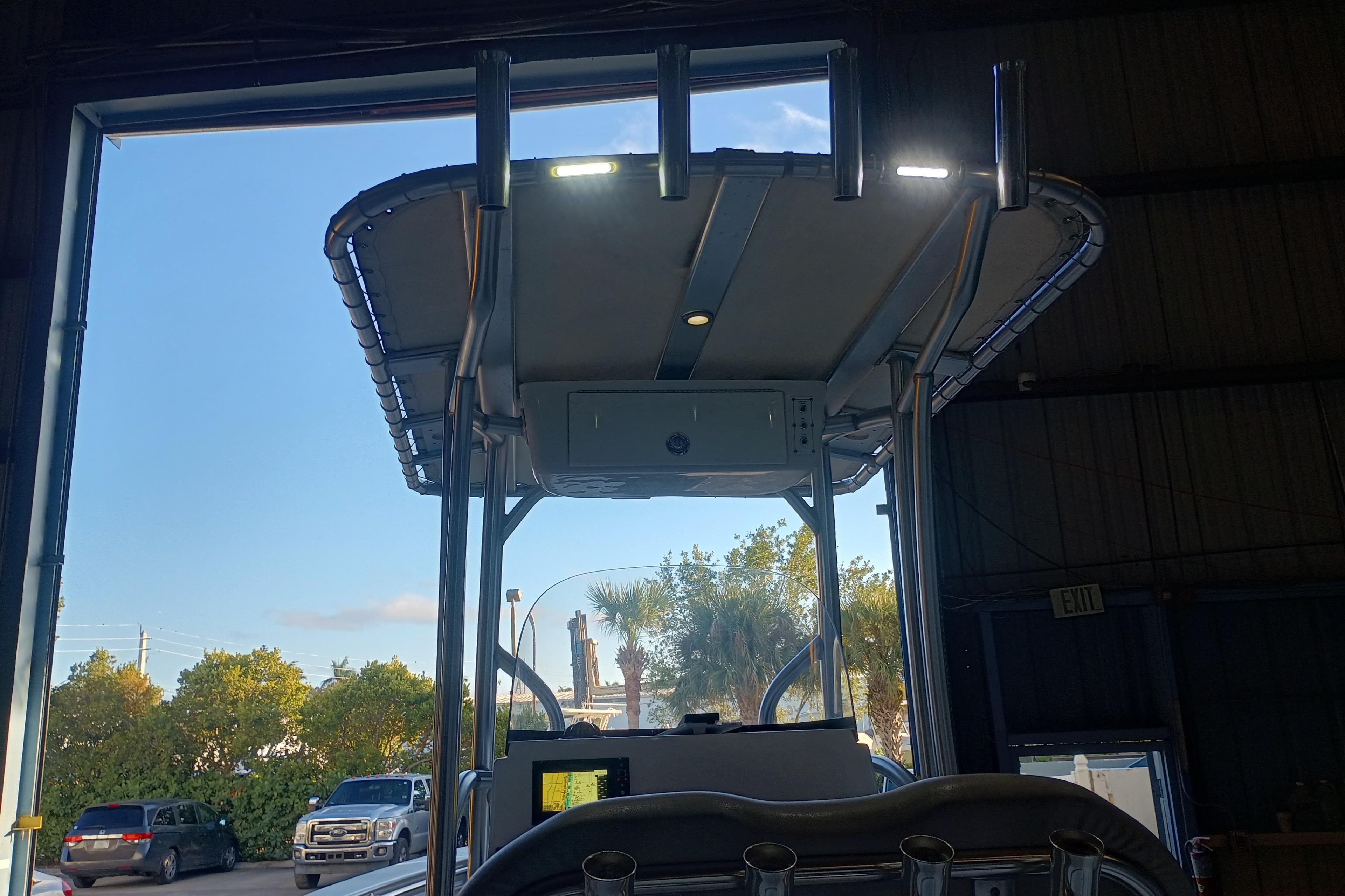 2017 Seapro 219 boat with T-top in a garage, exterior view.