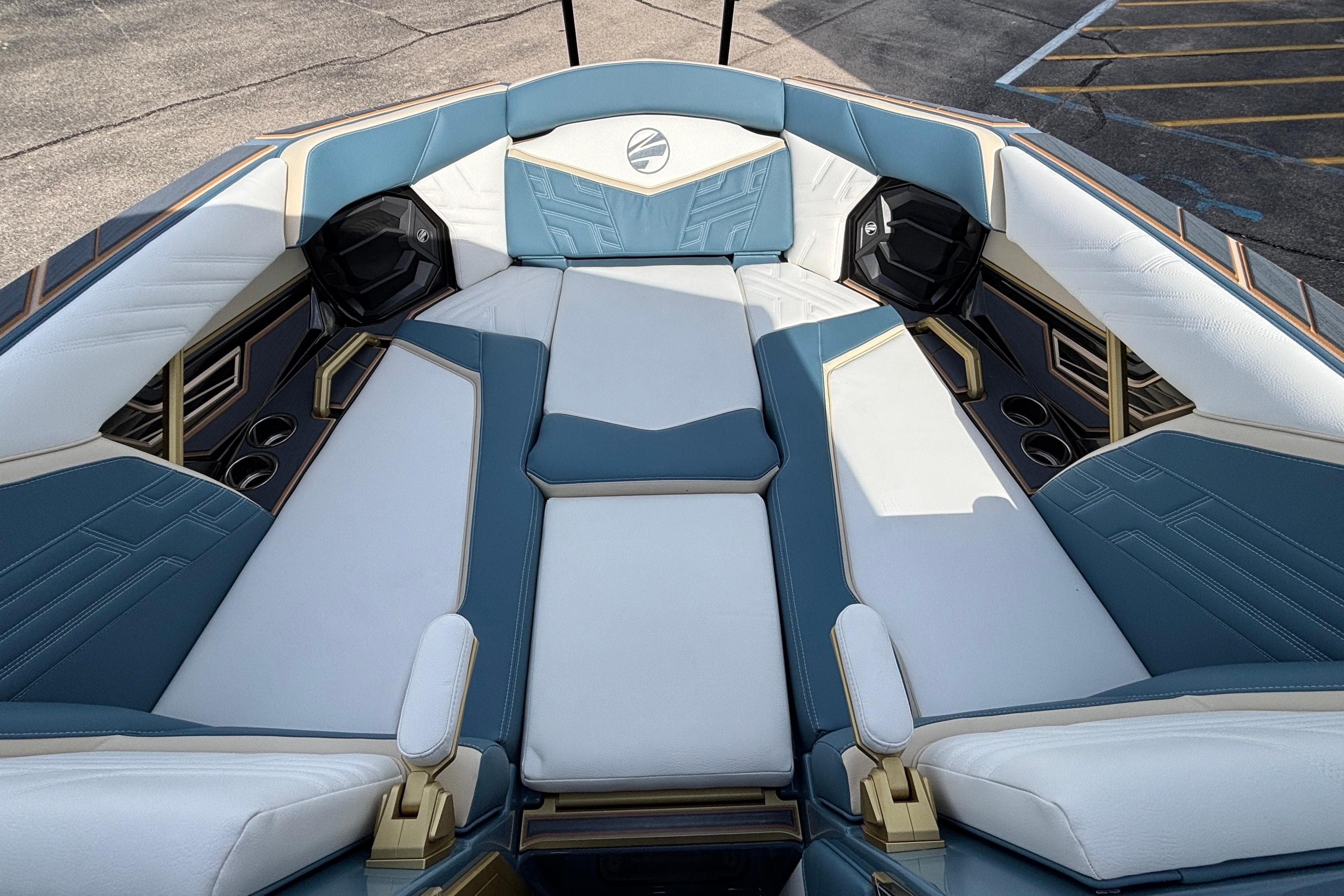 Luxurious interior of 2026 Tigé Ultré 25ZX boat with blue and white seating.