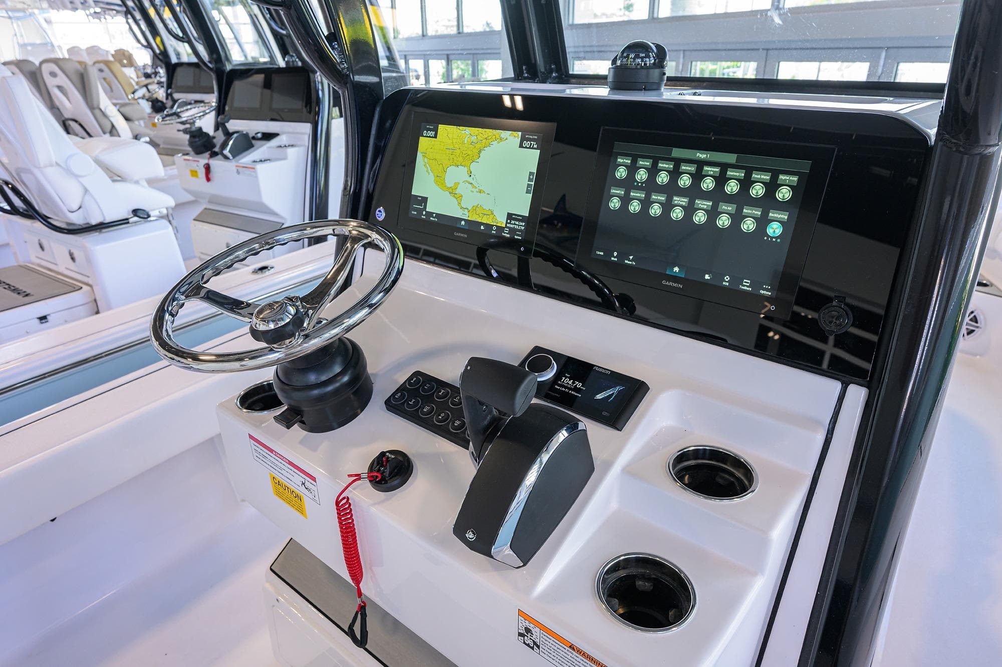 2026 Sportsman Masters 247OE Bay Boat dashboard with steering wheel and digital displays.