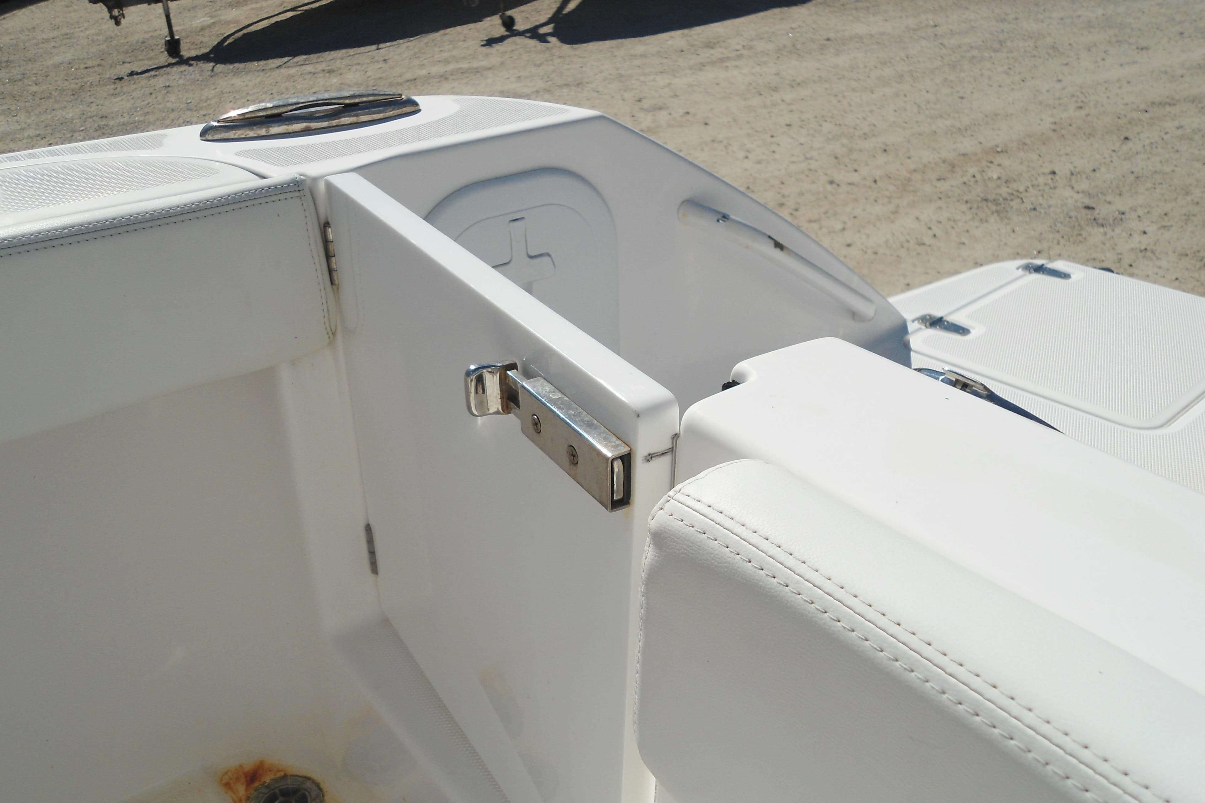 Edgewater 230CC 2019 boat interior with open hatch and white seating.