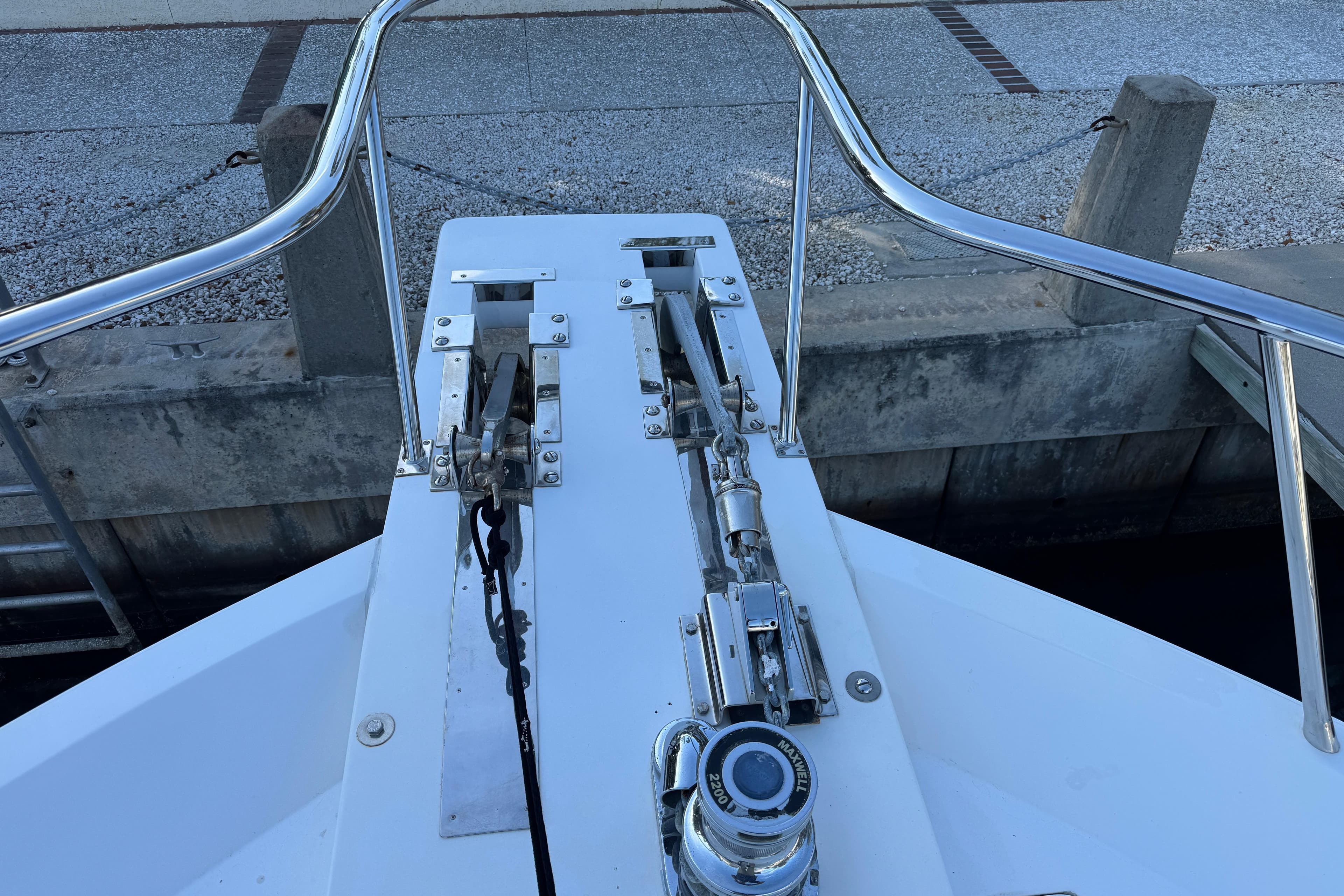 Bow of 2003 Altima 55 Pilothouse yacht with anchor system and railing.