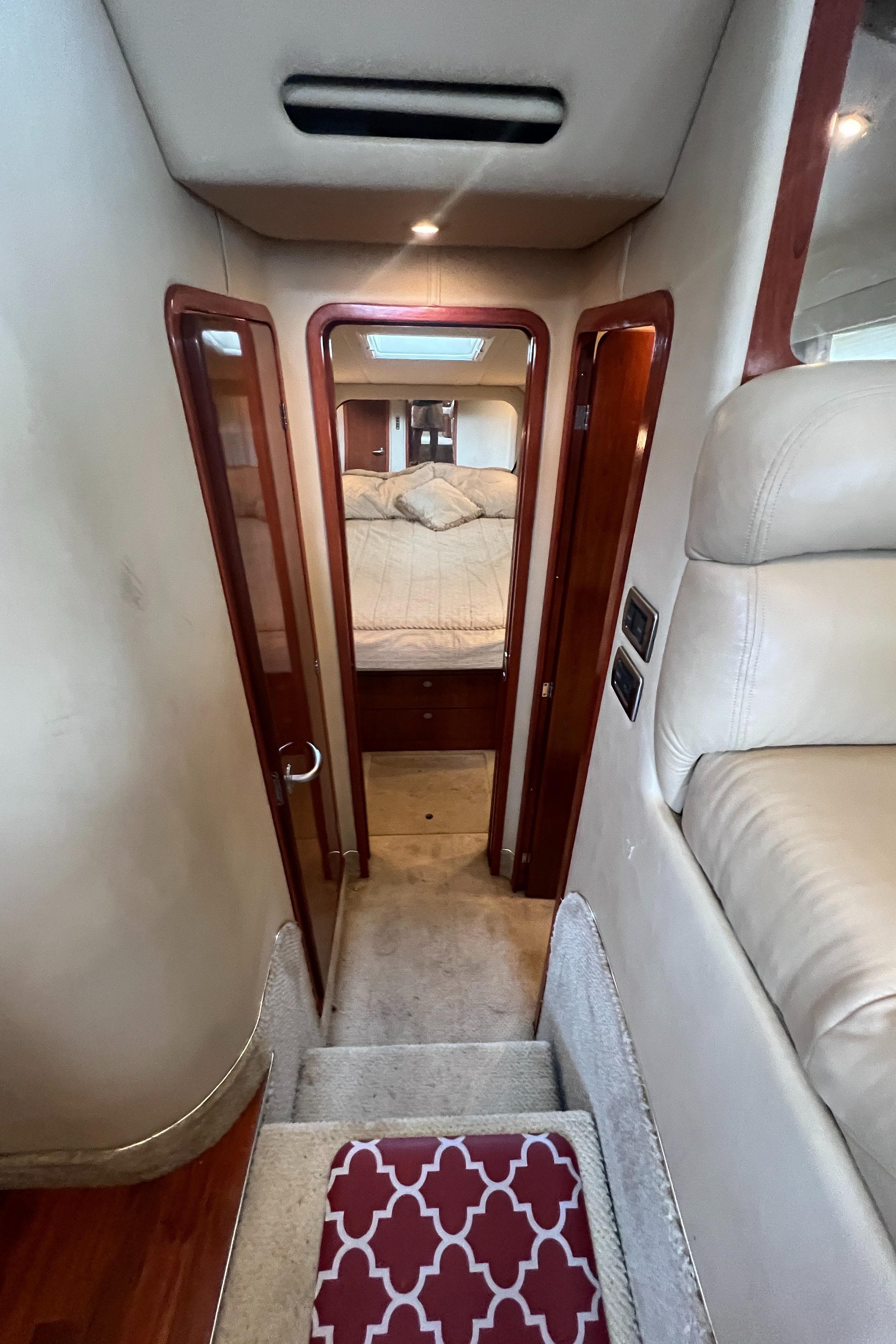Interior of 2004 Sea Ray 480 Motor Yacht showing cabin entrance and stairs.