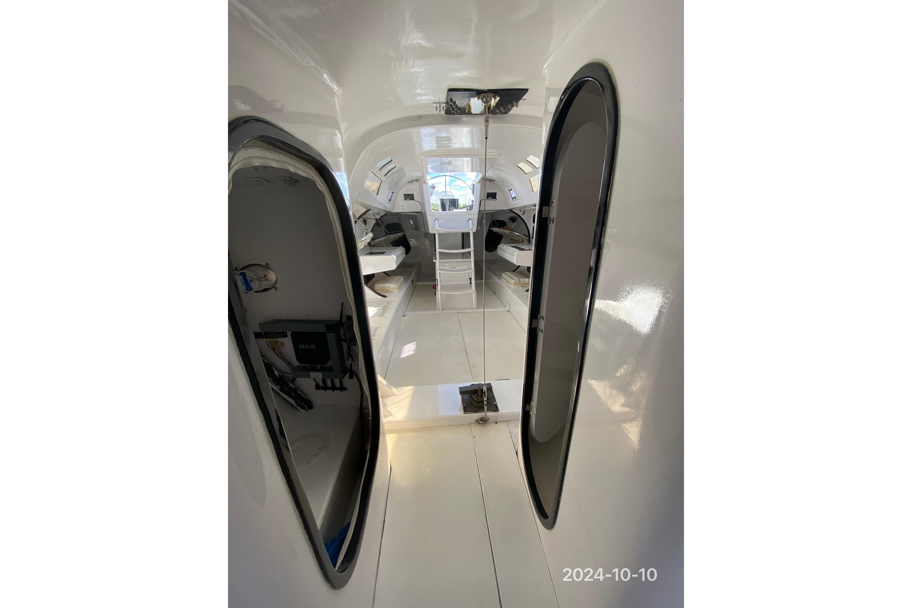Interior of a 1993 Nelson Marek 43 sailboat, featuring sleek white design.