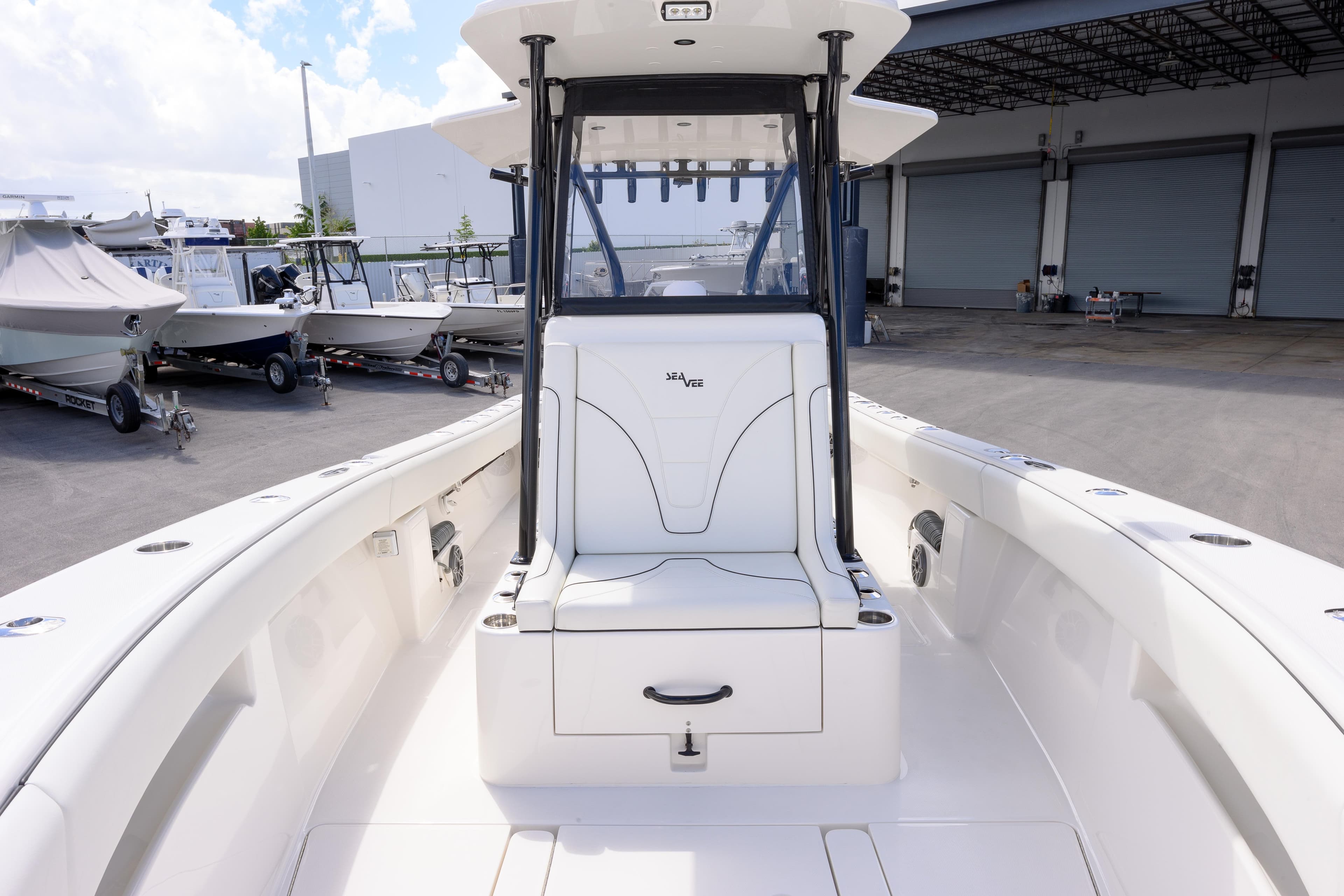 2025 SeaVee 290B boat interior, featuring sleek white seating and spacious deck.