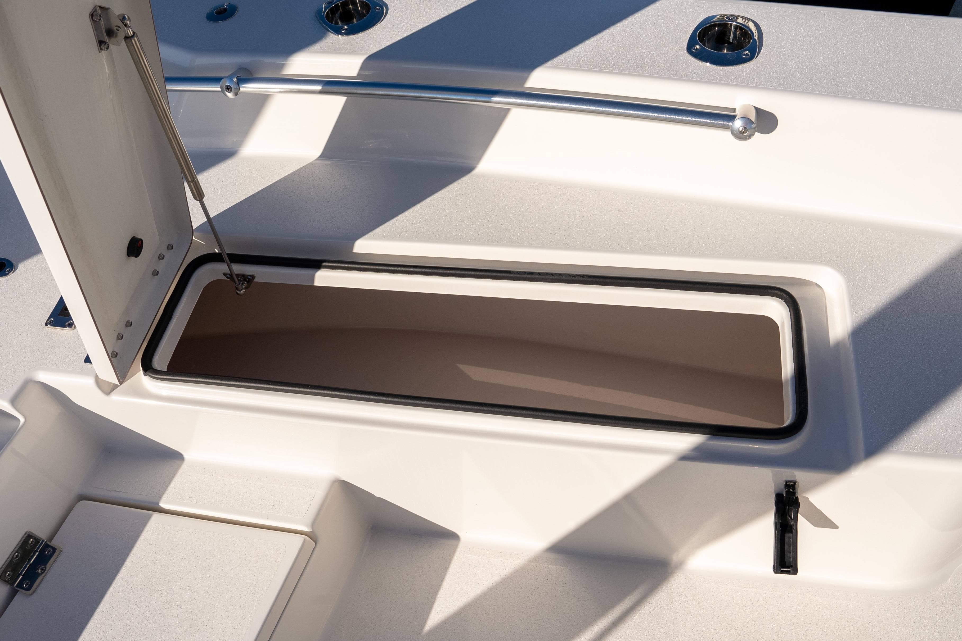 Open storage compartment on 2026 Bay Rider 269 Bay boat deck.