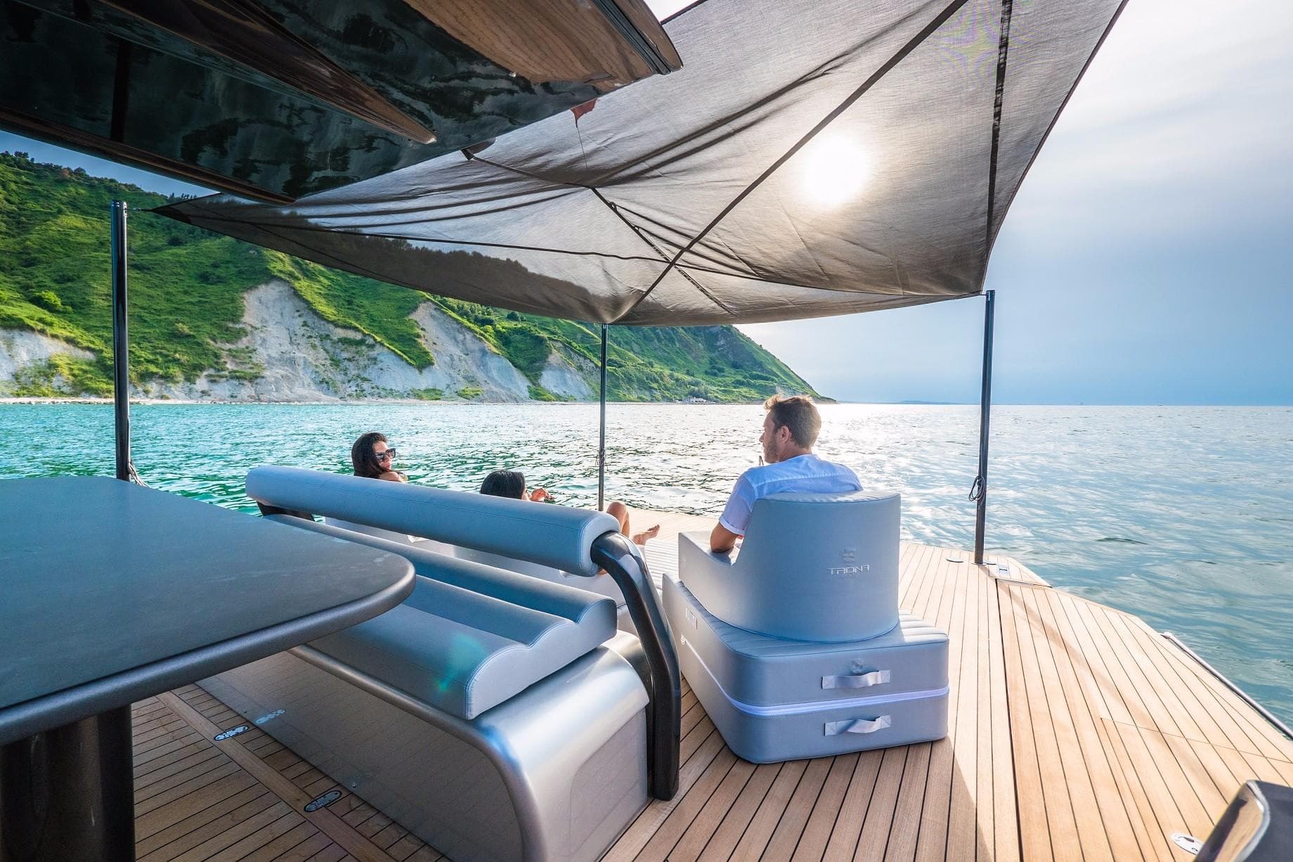 Luxurious Anvera 58S yacht deck with people relaxing, scenic ocean view, 2026 model.