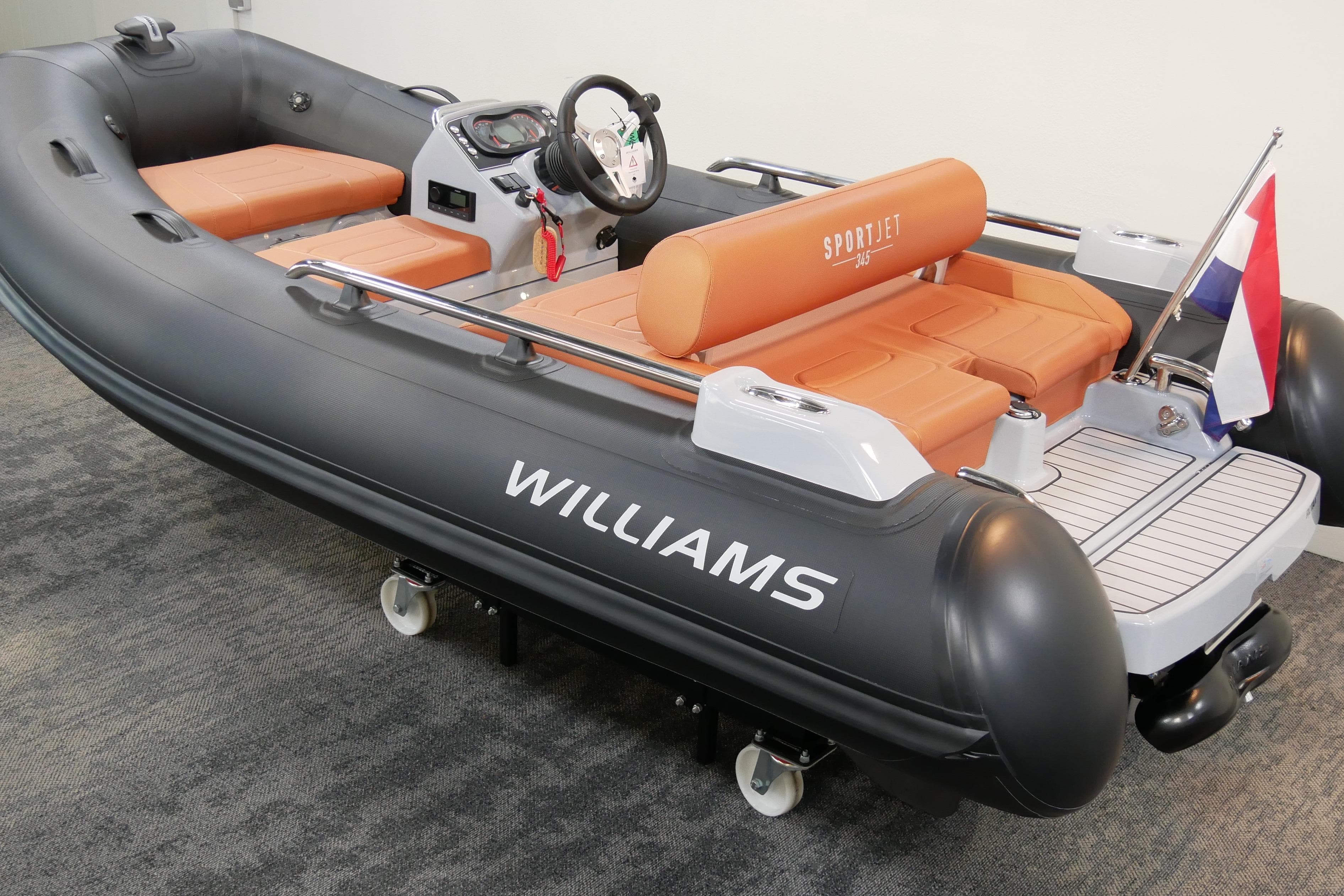 2026 Williams Jet Tenders Sportjet 345, sleek design with orange seating and a flag at the rear.