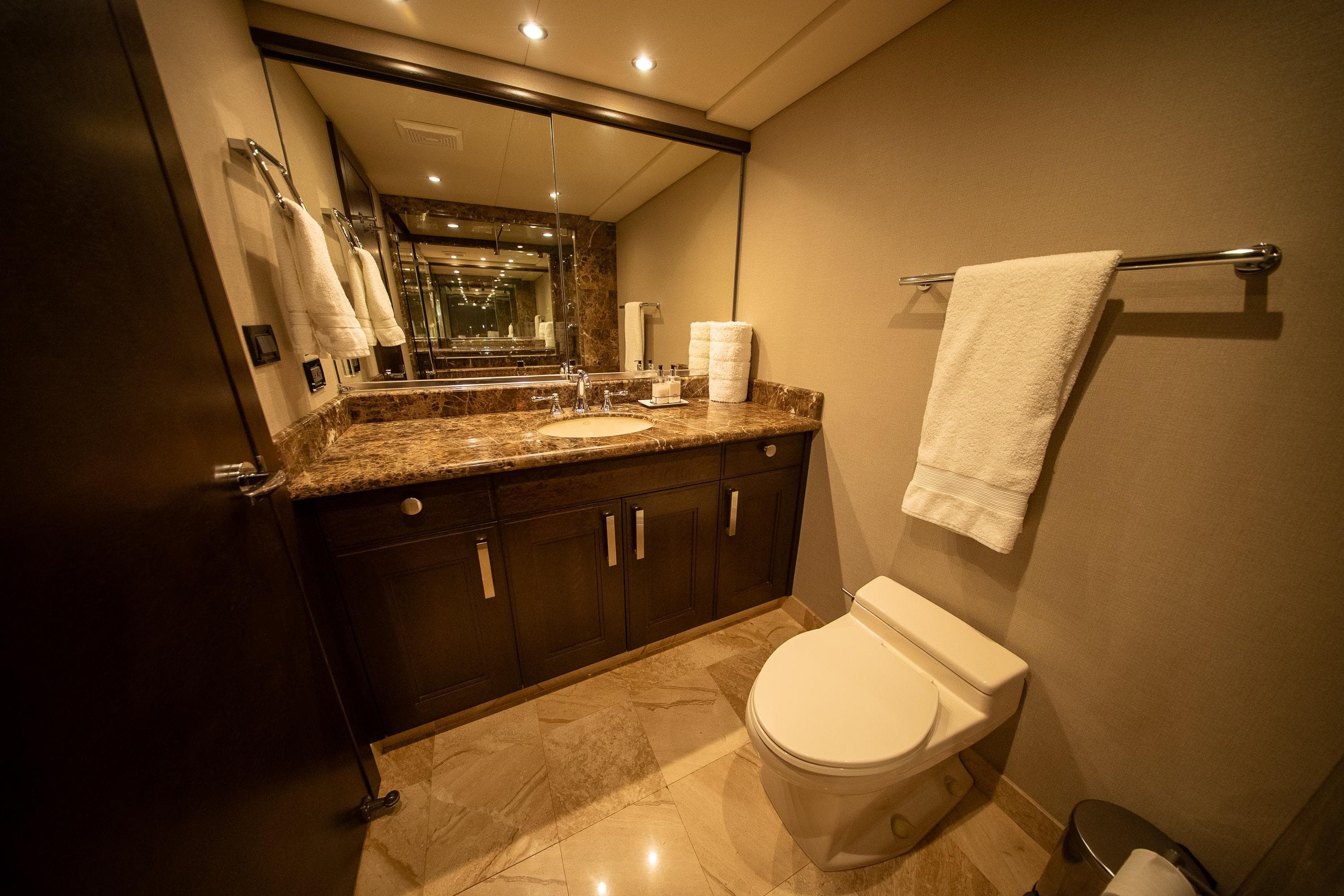 Luxurious bathroom with marble countertop, elegant fixtures, and soft lighting in a 1992 Crescent Custom.