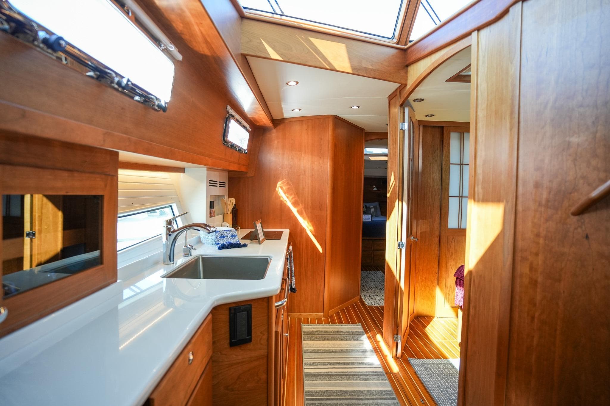 Luxurious interior of 2026 Sabre 51 Salon Express yacht with modern kitchen and wood finishes.