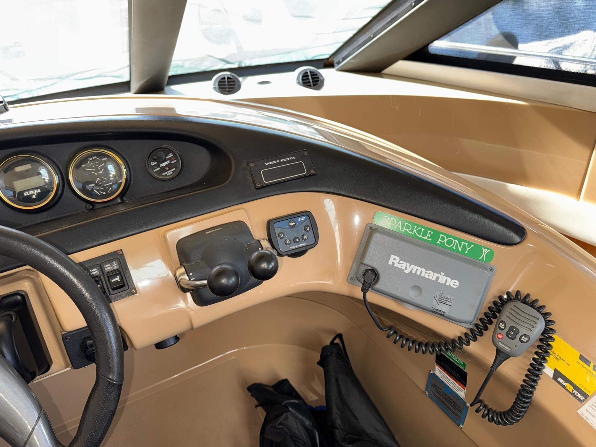 Interior view of 2002 Carver 570 Voyager Pilothouse dashboard with Raymarine equipment.